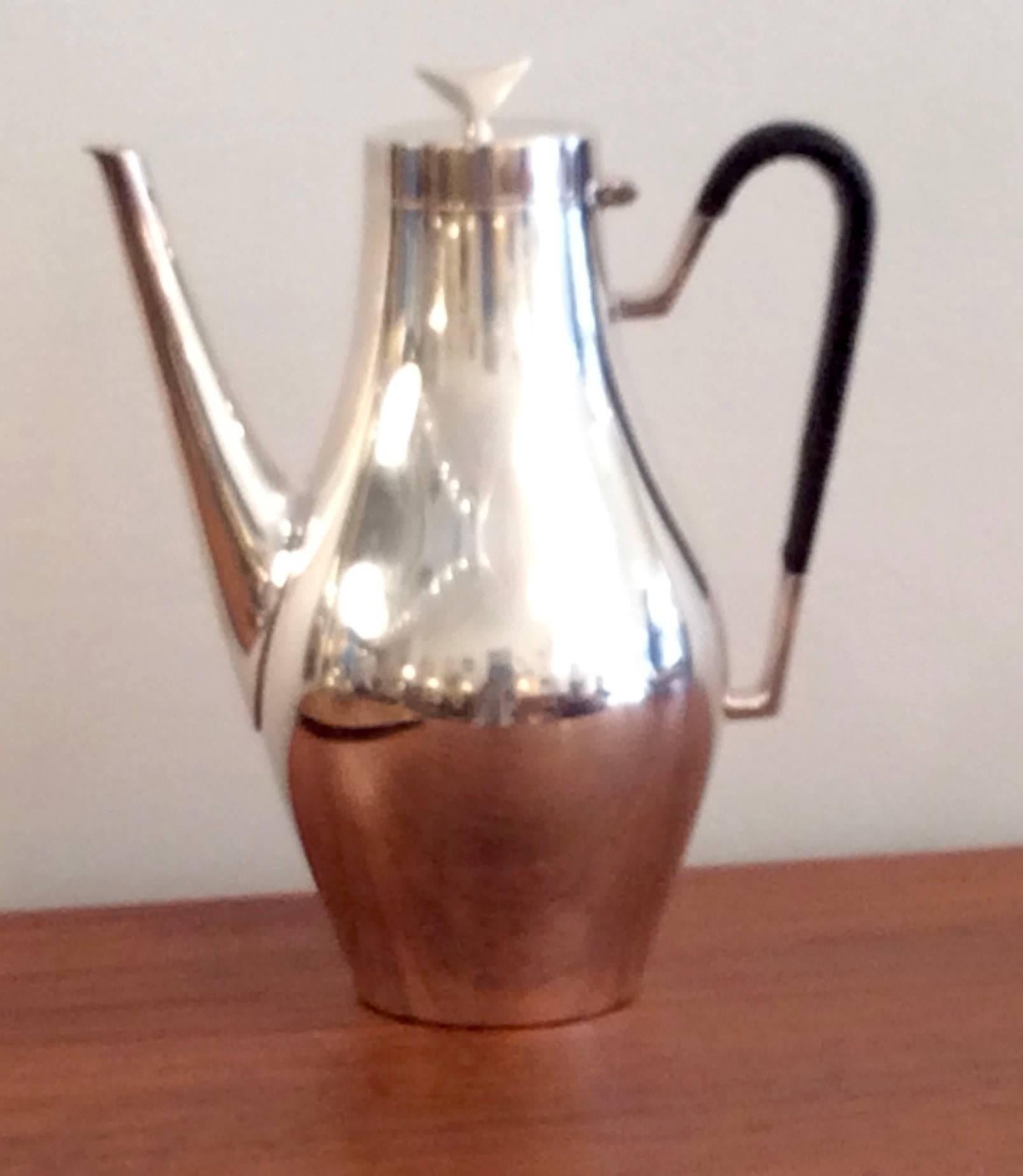 Elegant coffee pot by John Prip for Reed & Barton. Woven handle covers in great condition. Solid weight. Please note that we also have a teapot of the same design available.