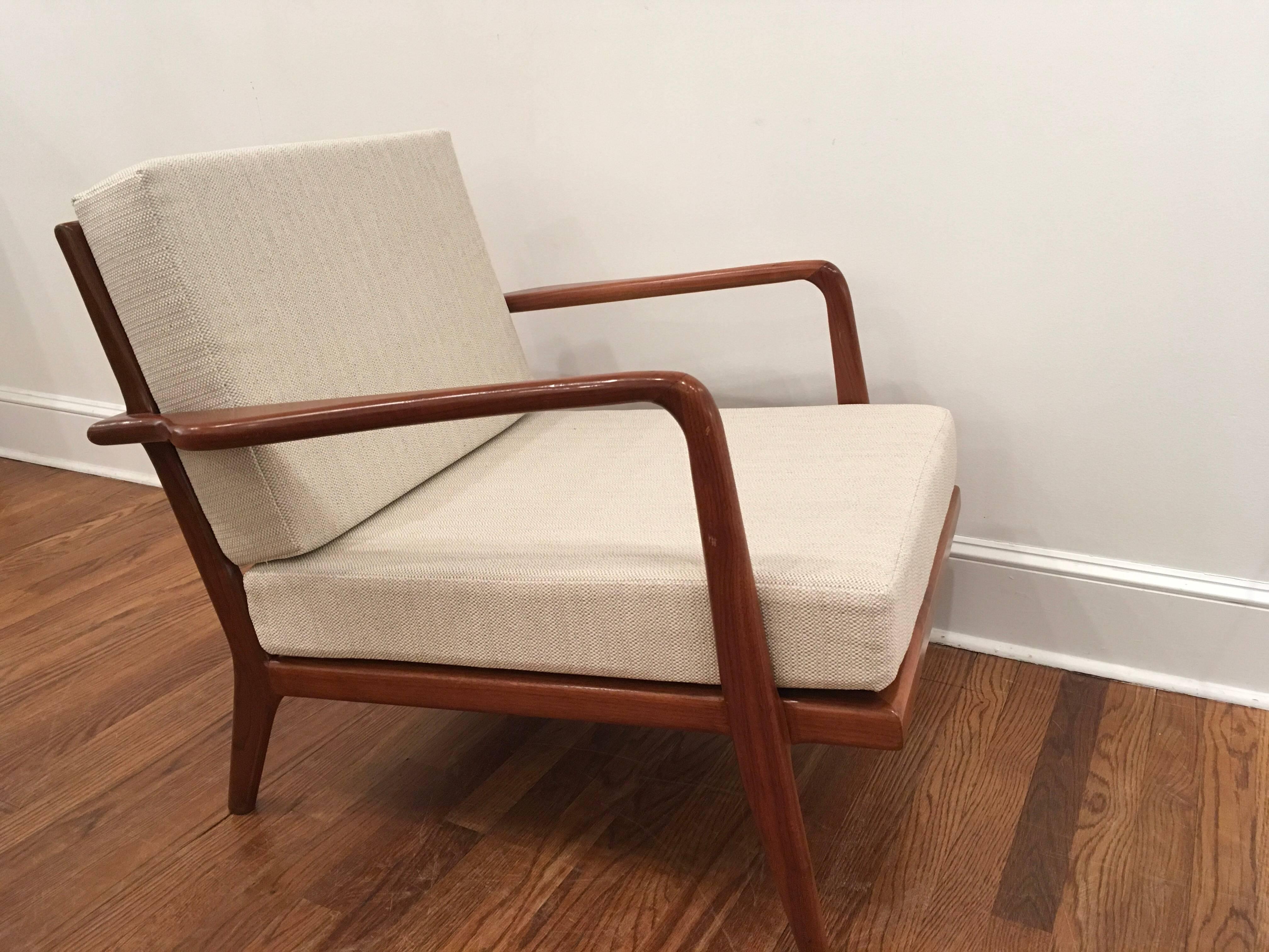 Pair of 1960s walnut armchairs designed by Mel Smilow. Recently reupholstered, the armchairs are deep and very comfortable. They are beautifully crafted and are stunning from every angle.