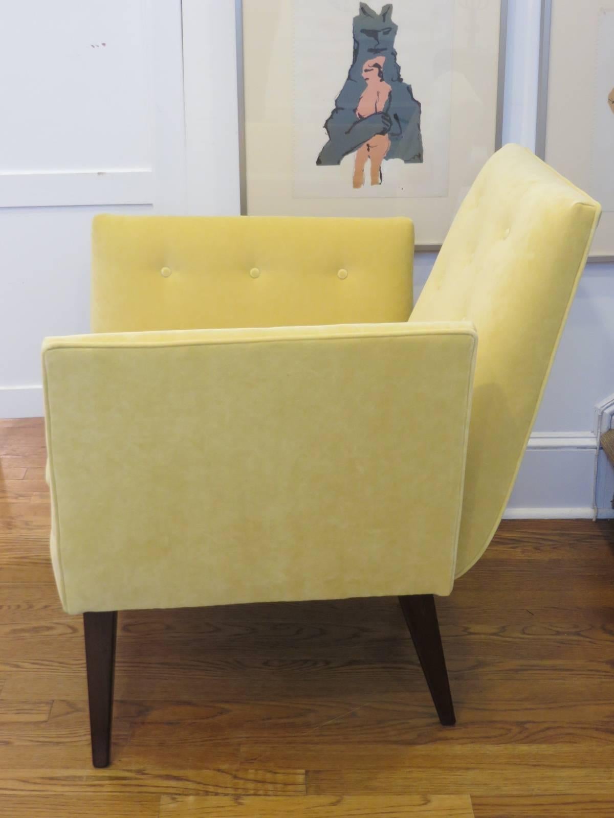 Elegant, newly upholstered and refinished velvet armchair with splayed legs. Sculptural nature of chair looks great from every angle. Chair is upholstered in soft yellow velvet which appears softer than indicated in photo.