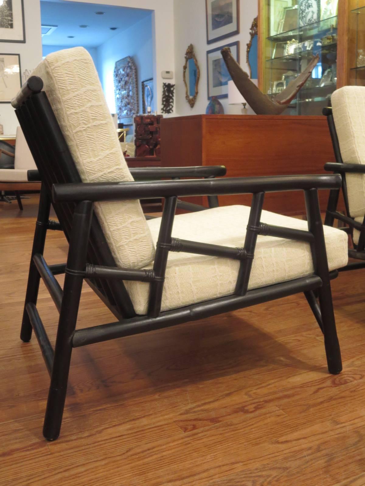 Black lacquered bamboo lounge chairs with new upholstery.
Settee also available.