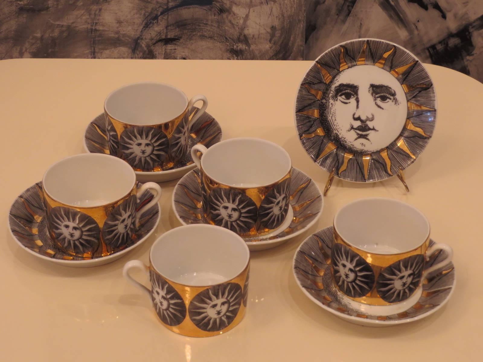 Set of five vintage Sun-Sole porcelain cups and saucers by Piero Fornasetti.

    