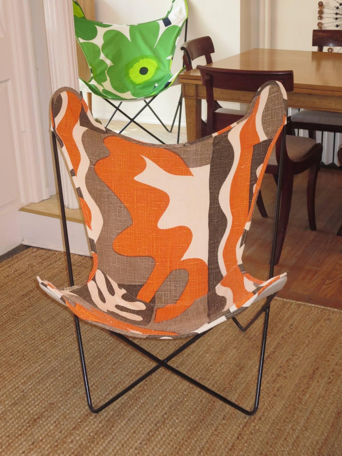 Iconic Knoll butterfly chair with custom-made sling. The Fabric used to make the sling is vintage and is backed in linen. The look is striking. The chair is very comfortable and sturdy. Can be used inside or outside. We have other butterfly chairs