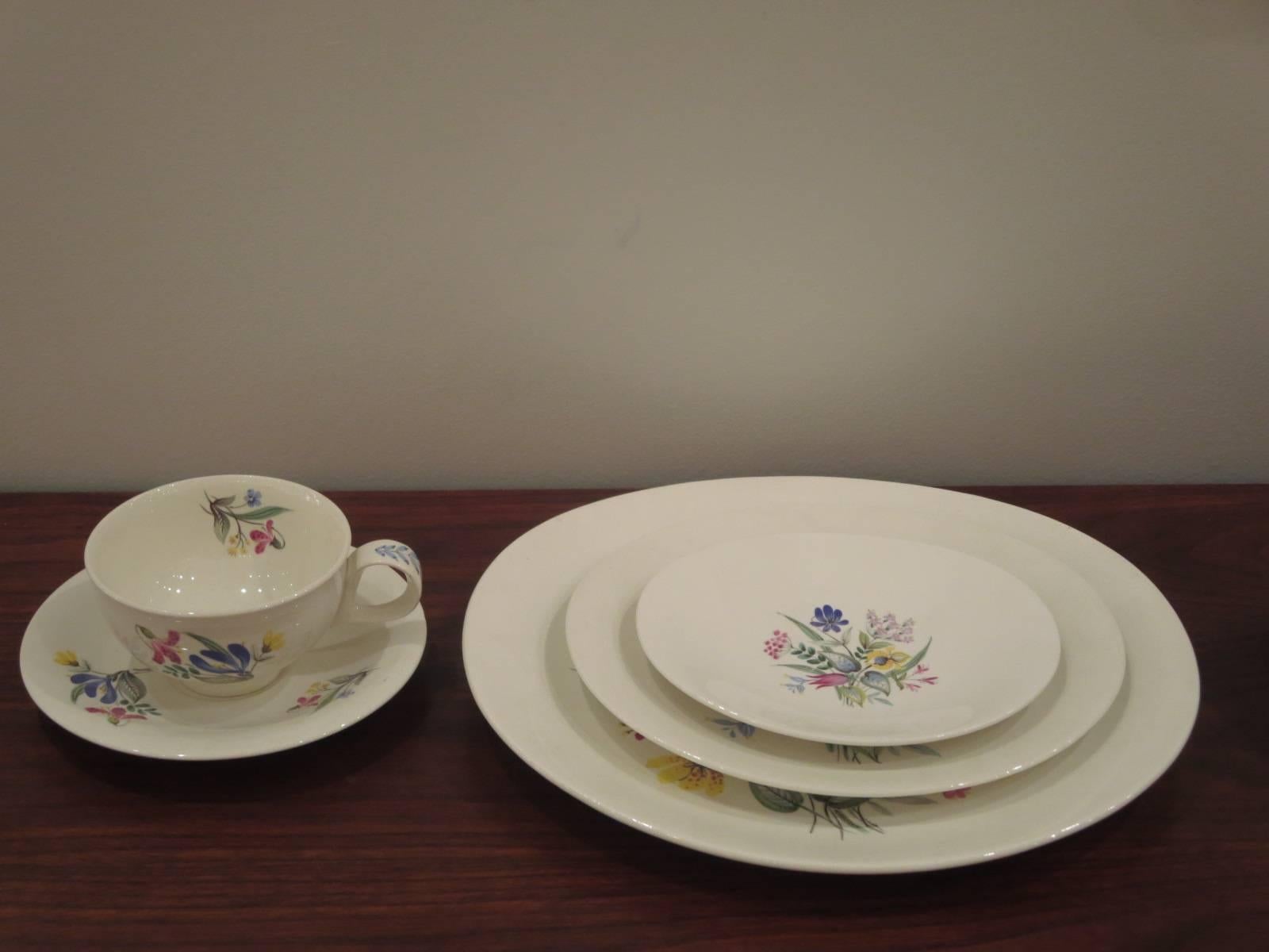Eva Zeisel five pieces place setting for six: Hallcraft China Bouquet Pattern by Hall China .This set is in nice vintage condition; due to their use some of the flower patterns present some light scratches.