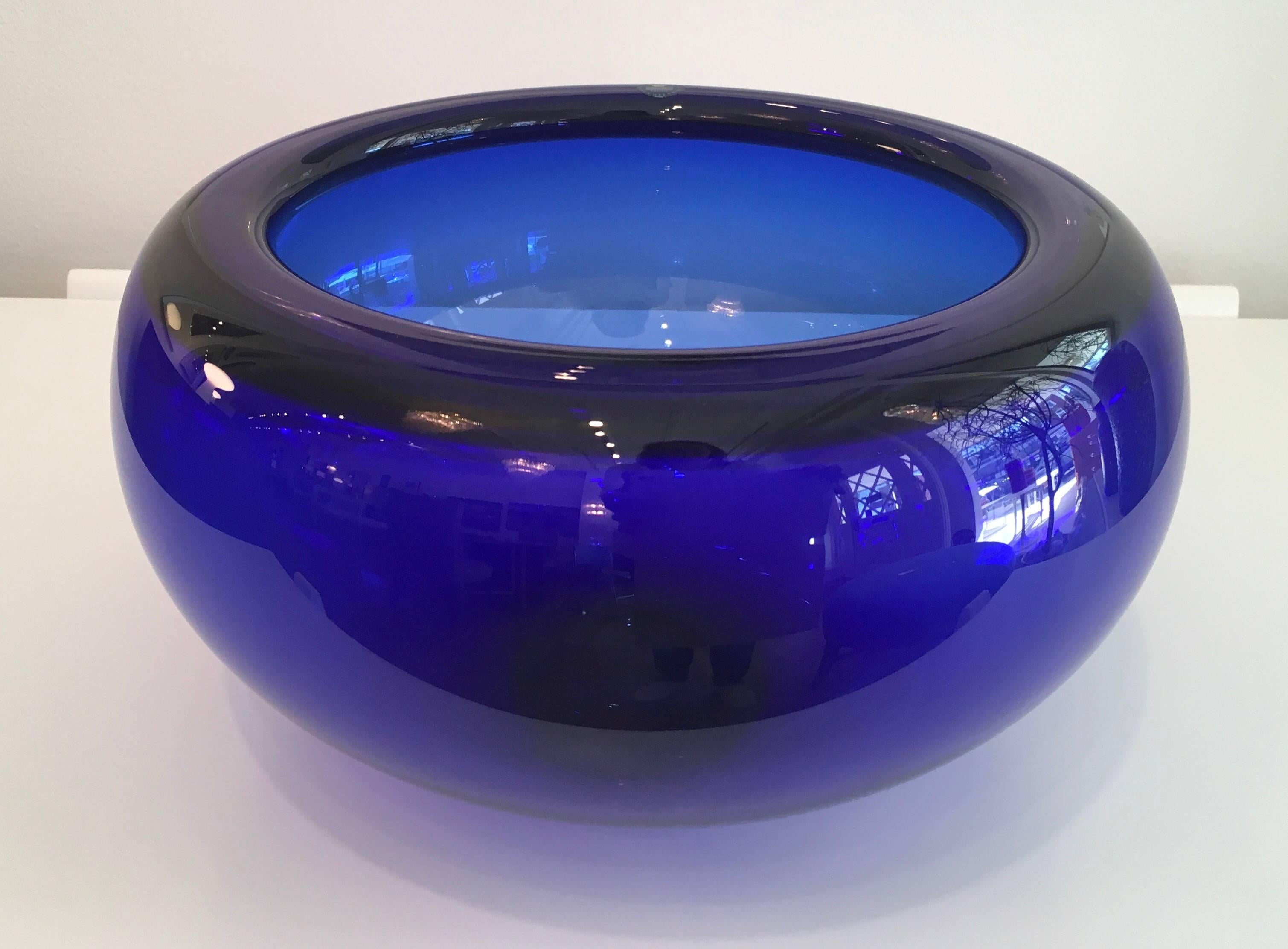 Large Royal Copenhagen bowl in deep blue crystal. Designed by Per Lutken in 1950s. Maker's label still attached.
