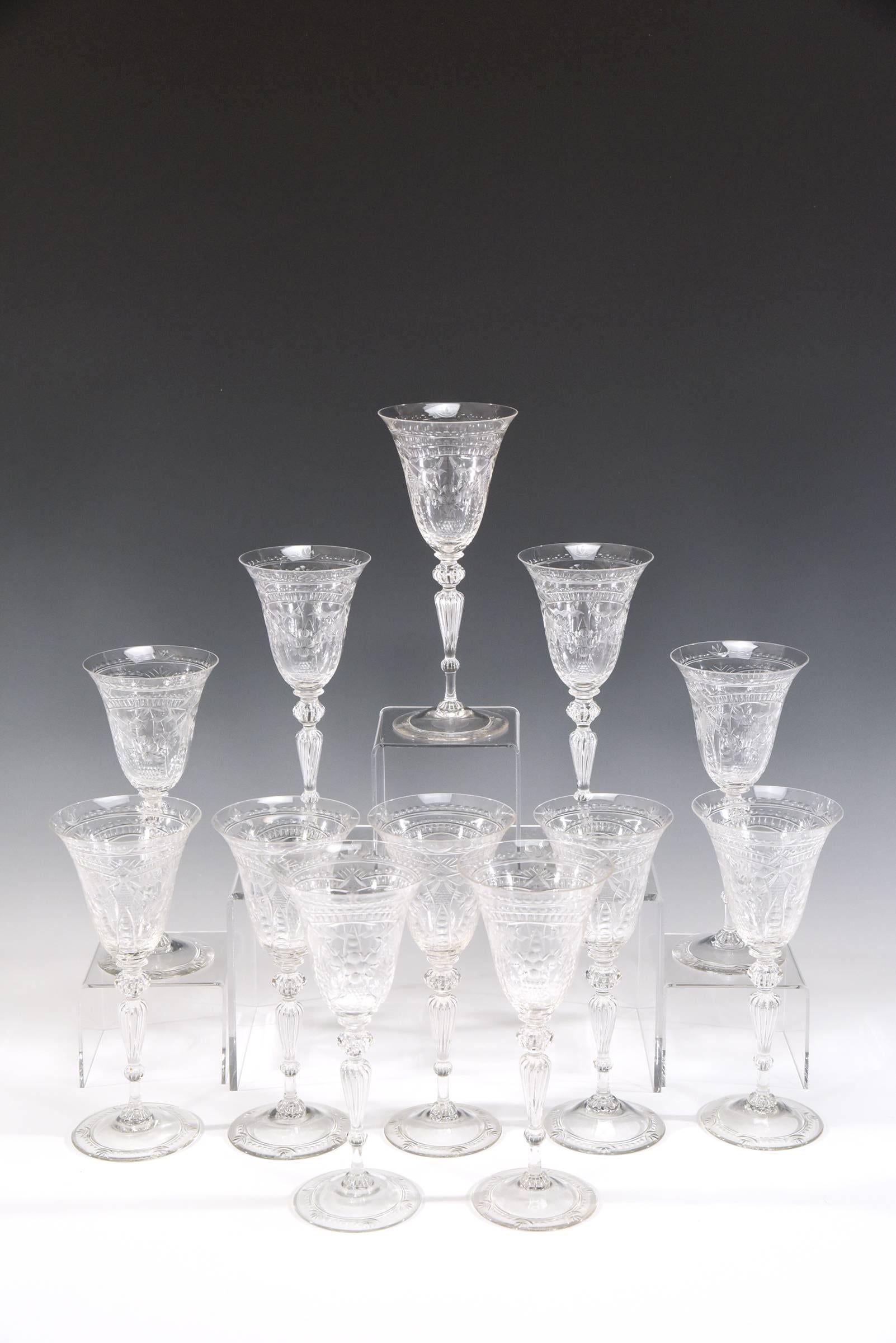 Not 1 but 12!! A rare treat for the Steuben collector. This is an amazing set of 12 handblown goblets made in the Venetian style and exhibiting all the qualities and craftsmanship of Steuben's finest works. The very tall but well balanced goblets
