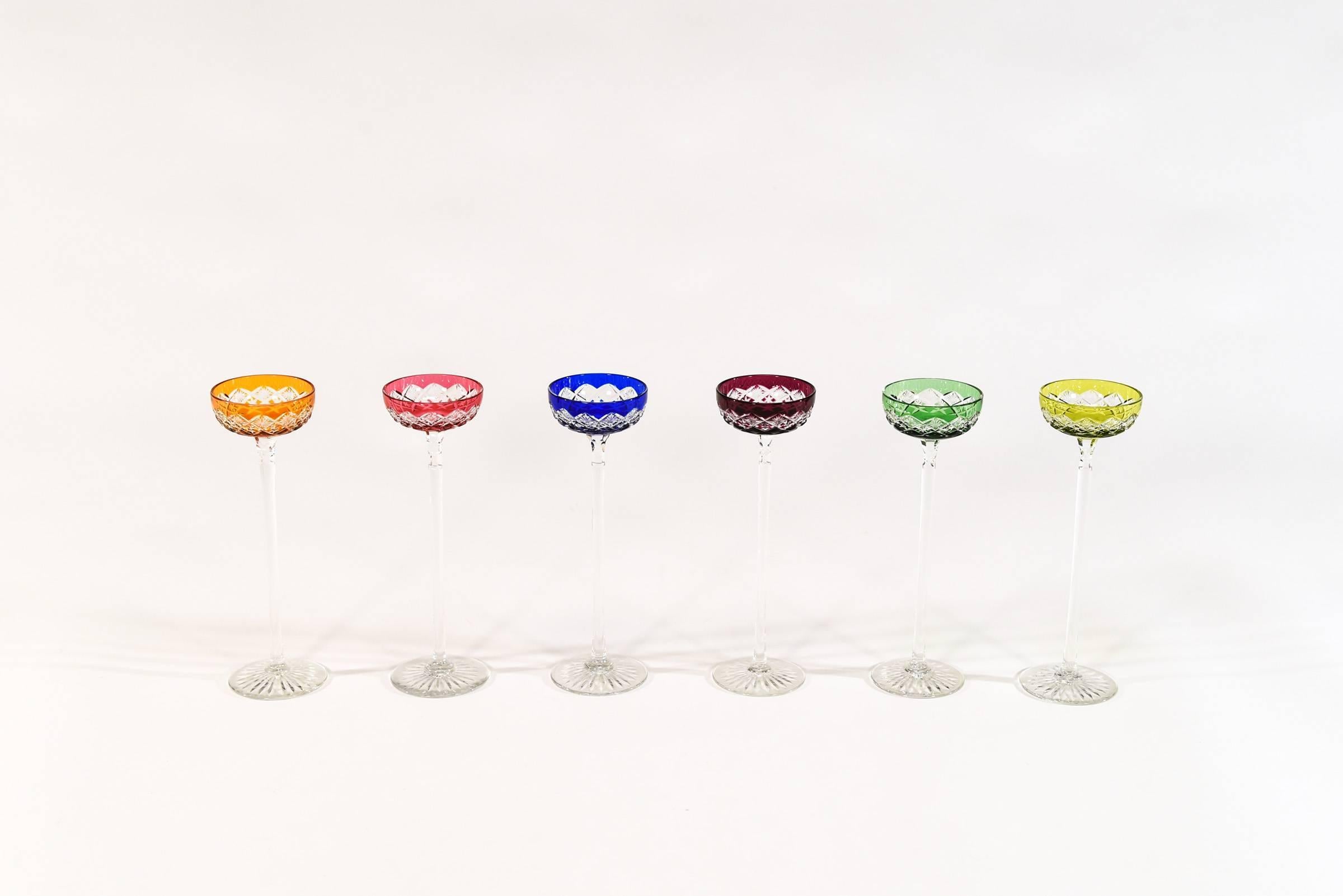 This rare set of 6 Baccarat hand blown cordials is comprised of a range of vibrant jewel-tone colors. Standing 7.88