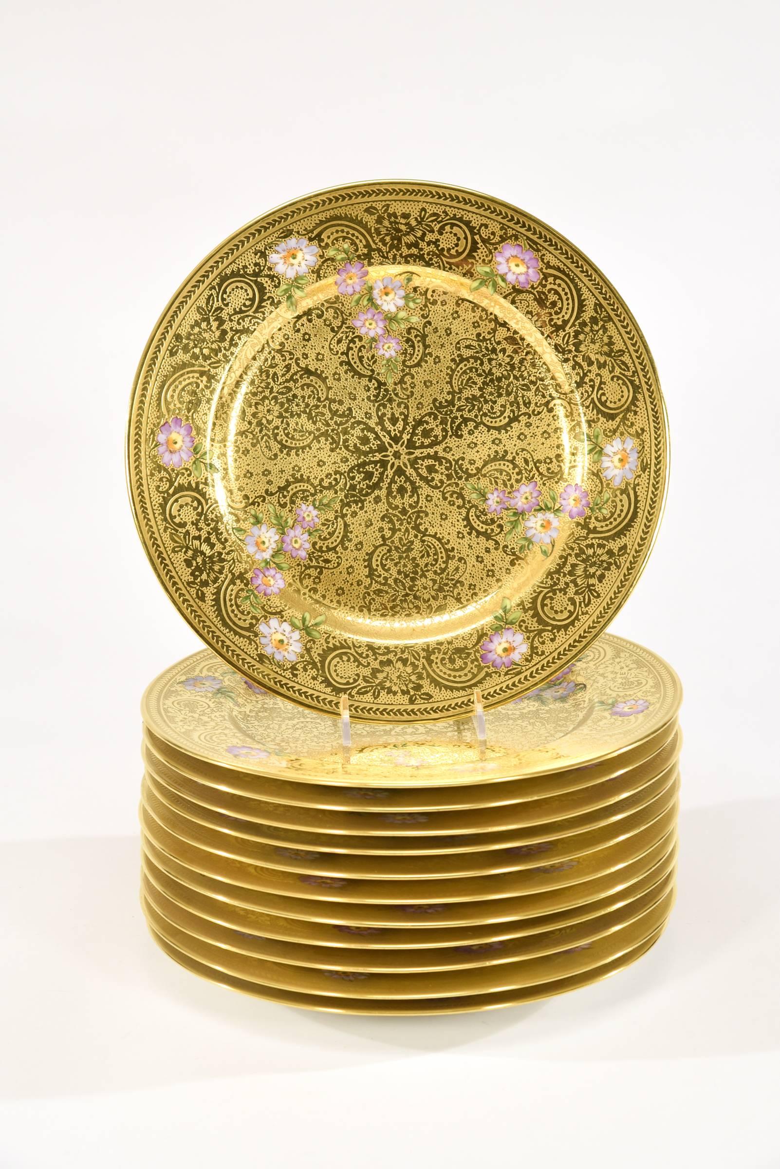 This is an exquisite set of 12 service/presentation plates that will be the focal point of your elegant table setting. Made by Limoges Elite, they feature all-over embossed and acid etched gold which is overlaid with lavender hand-painted enamel