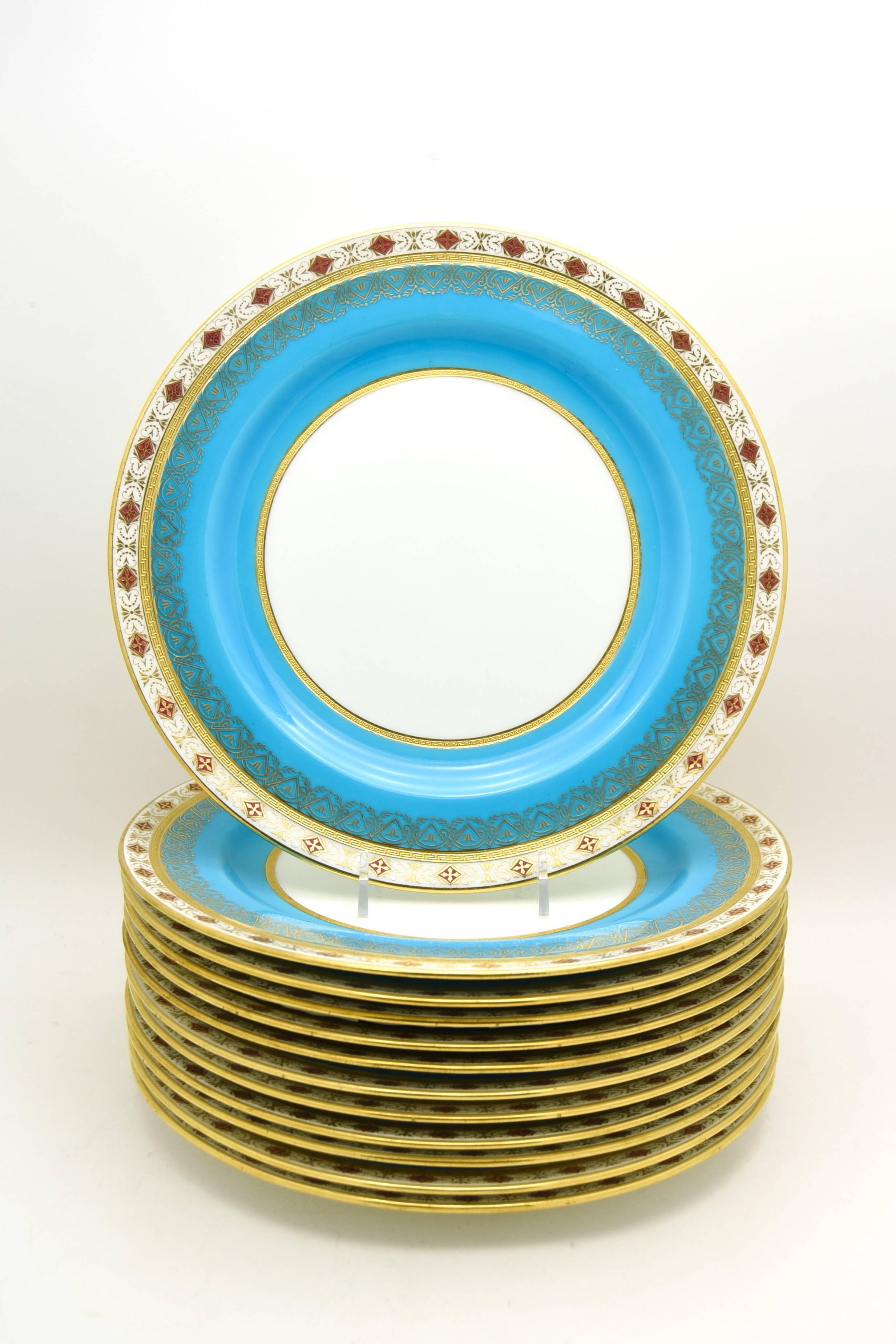 This is one of my exceptional sets of 19th century Minton dinner plates retailed by the illustrious Wilhelm and Graef, New York. They feature a rich, deep turquoise border, a clear white center and acid etched Greek key stylized gold bands, all