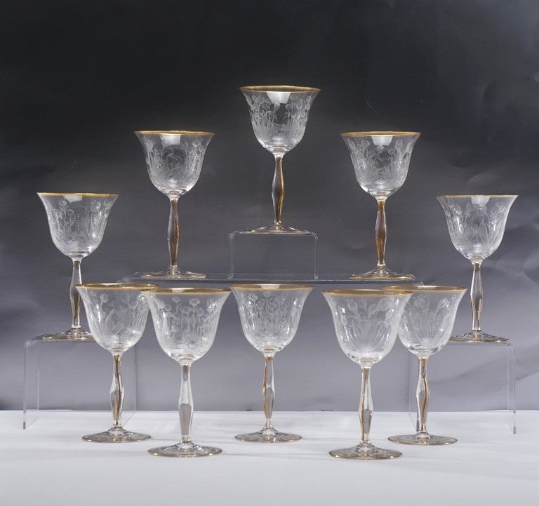 This set of 12 tall and elegant set of handblown crystal goblets feature a masterfully wheel cut Art Nouveau floral motif. Standing 6 3/4