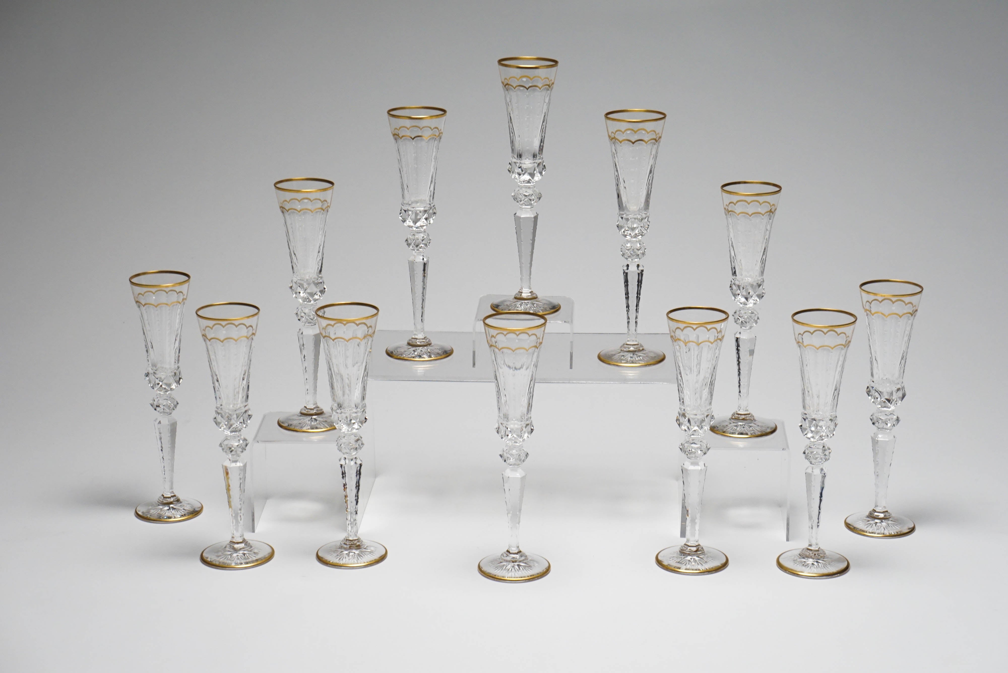 These are perfect for ushering in the holidays- a set of 12 mint condition handblown crystal champagne flutes in the ever glamorous 