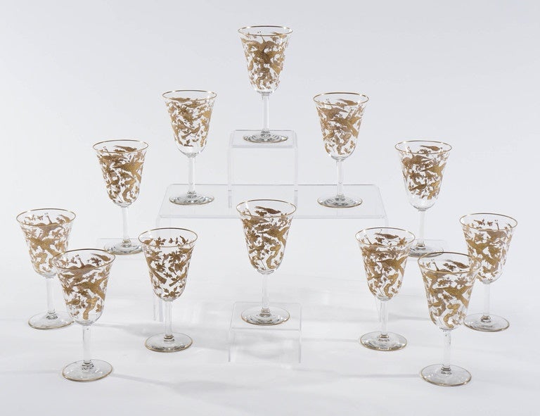 An amazing set of 12 handblown crystal wine or water goblets attributed to Baccarat. These are especially perfect as a complement to other gold decorated patterns, especially simply decorated crystal. These elegant goblets are beautifully decorated