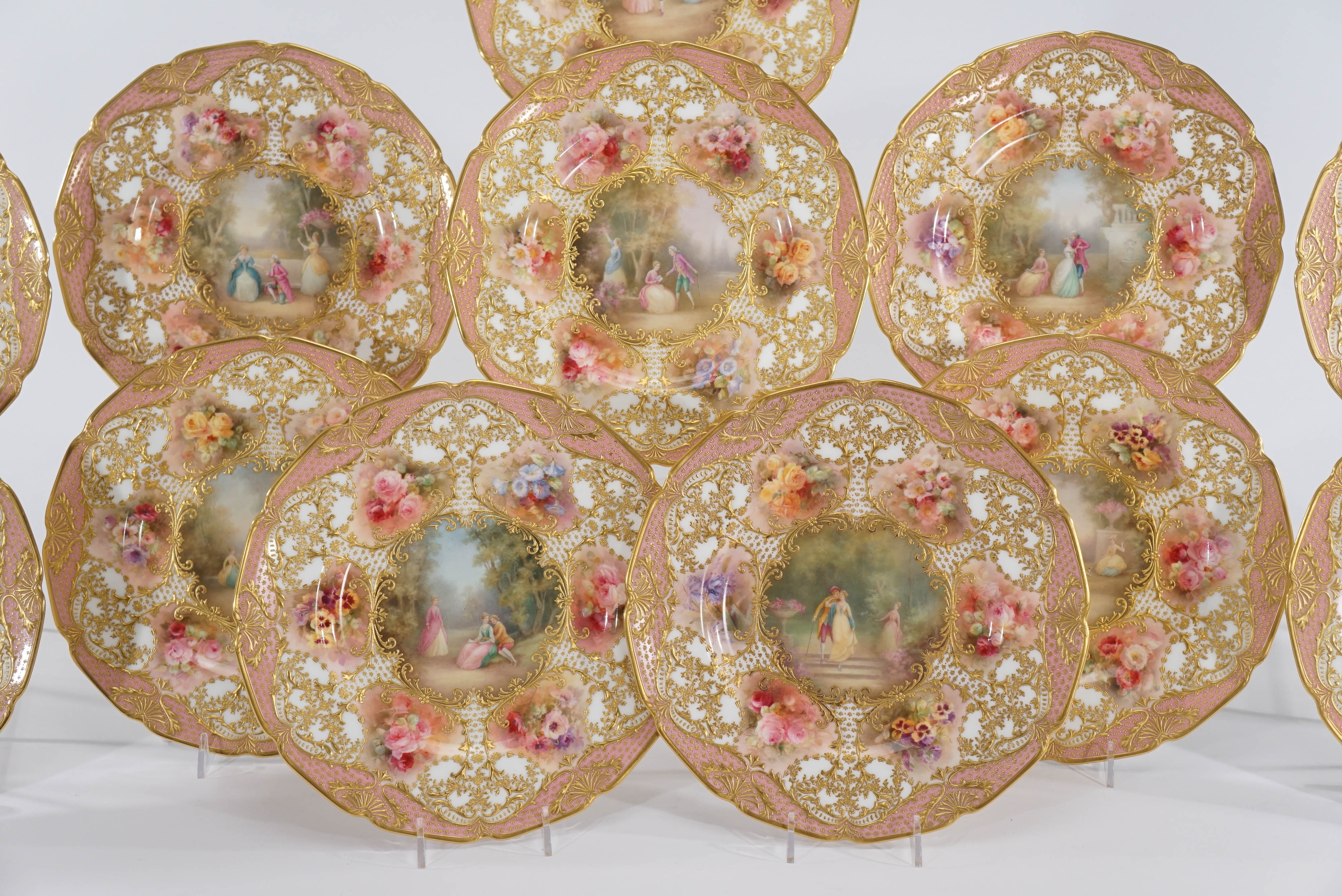 This is a spectacular set of 12 Royal Doulton cabinet plates that are museum worthy. Each one is hand painted, artist signed by two of Royal Doulton's most famous artists! The center Watteau scenes are signed by the infamous Leslie Johnson and the