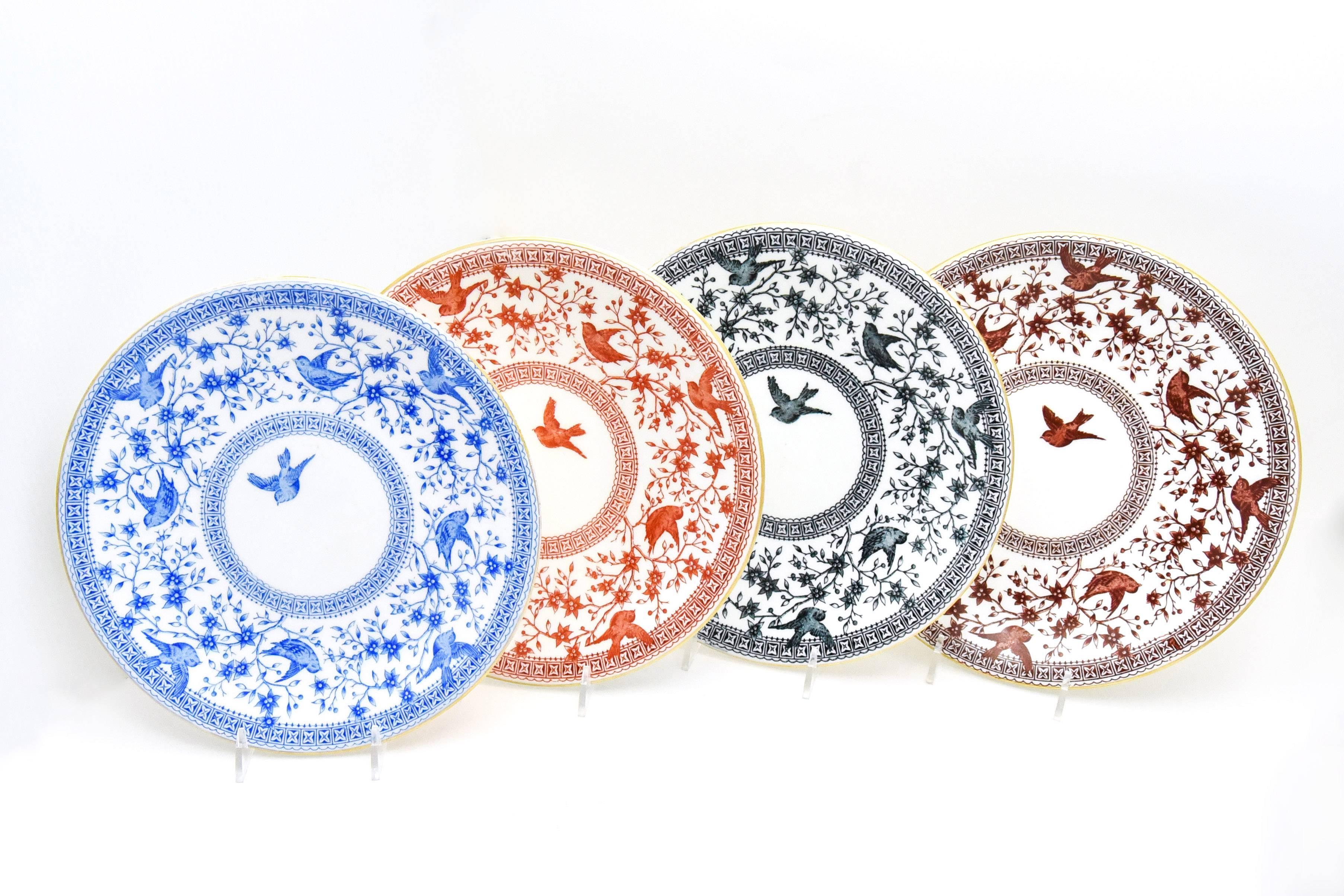 This is an unusual set of 12 19th century. Derby dessert/luncheon plates with birds in flight in four colors in a Classic aesthetic movement pattern. There three each, of the four earth-tone colors pictured: Imari Orange, blue, black and