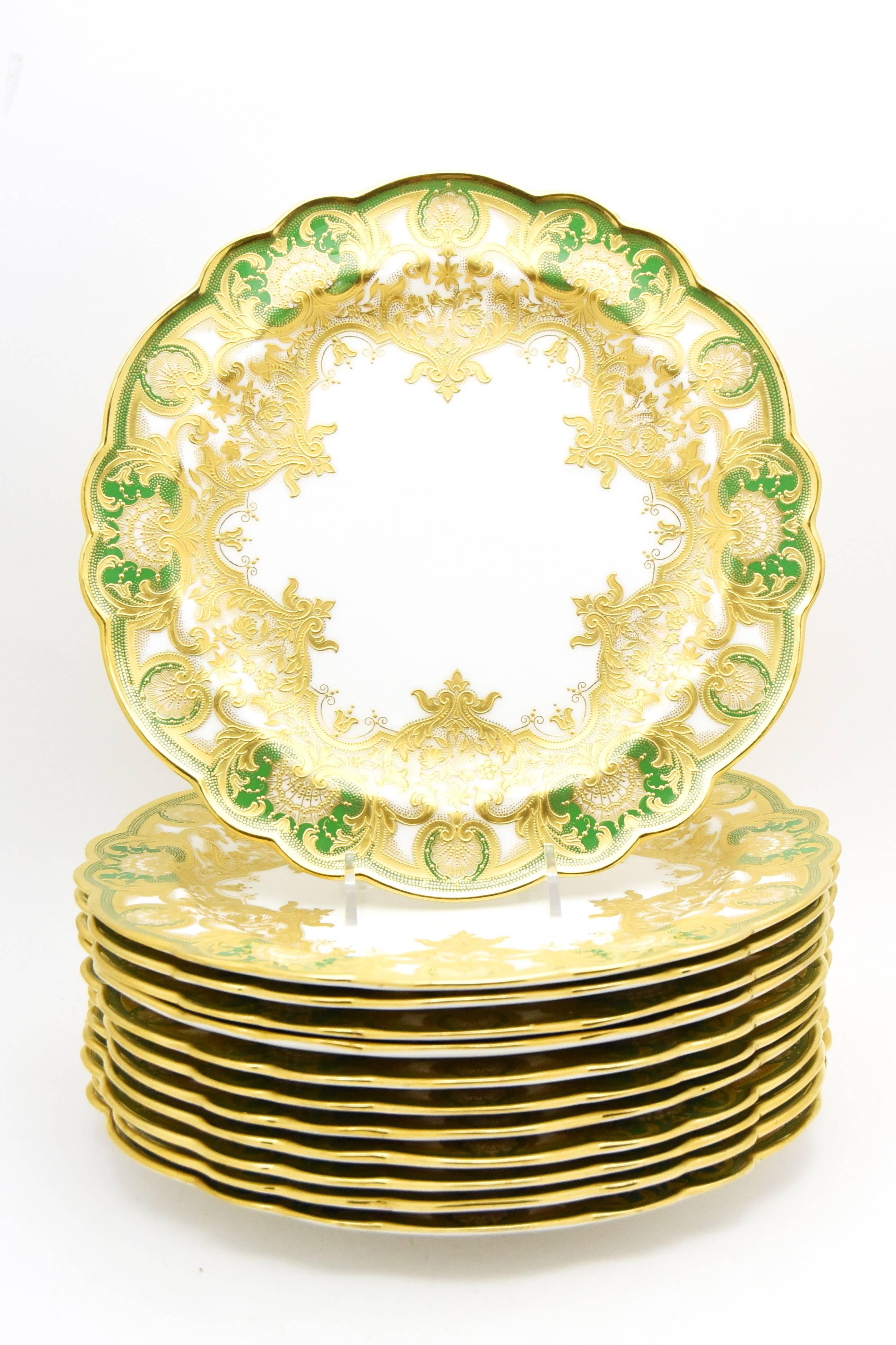 This is a set of 12 breathtakingly beautiful dinner plates made by Royal Worcester exclusivlely for A.B. Daniell & Son, London. They have all the characteristics of their finest pieces-apple green enamels, shaped rims and masterfully applied raised