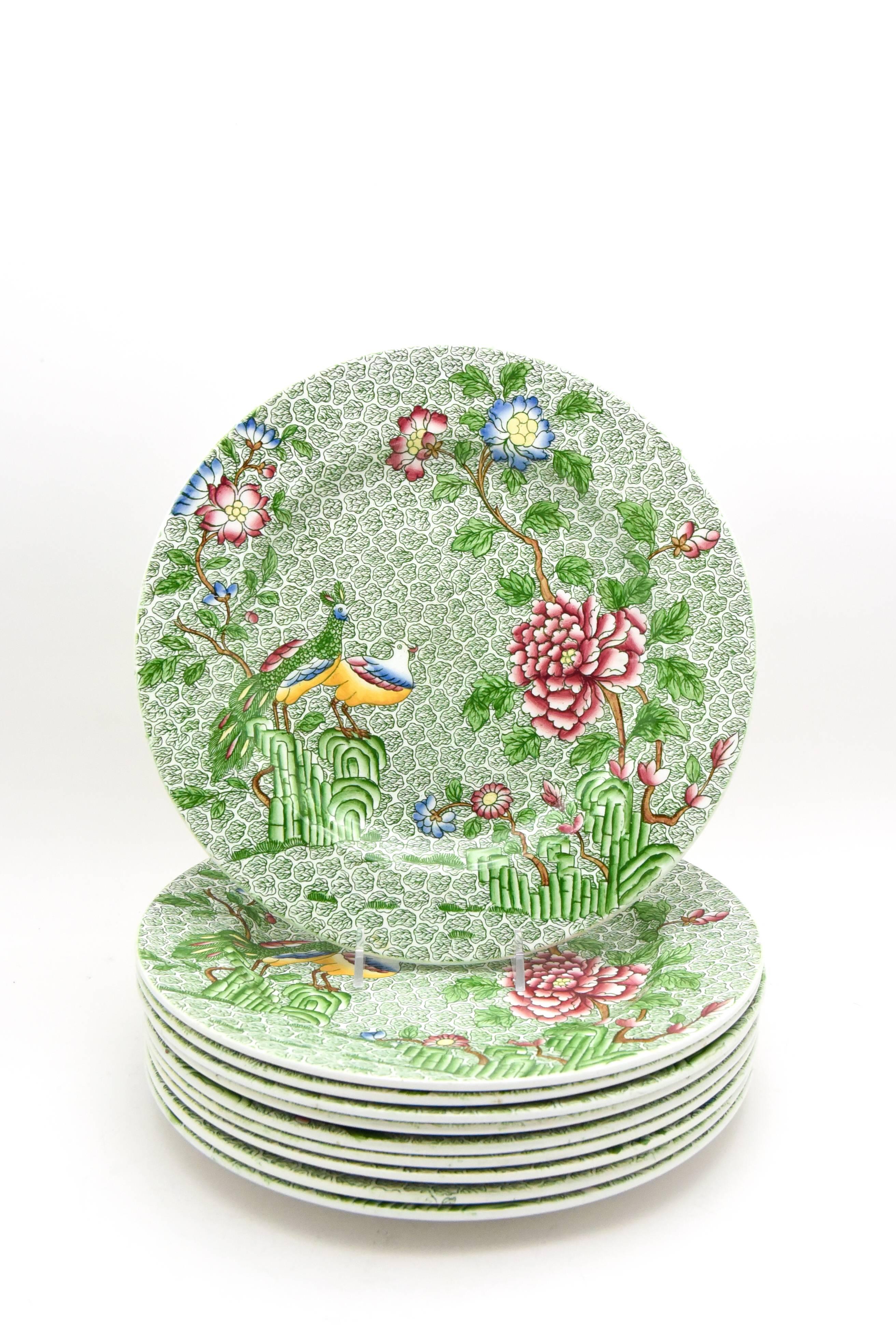 Just in time for spring, this set of ten Copeland late Spode dinner plates are sure to delight. The vibrant apple green all-over ground is decorated with two fanciful birds perched on a branch and the garden overflows with brightly colored