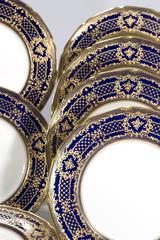 16 Royal Doulton Cobalt Blue Dinner Plates, Raised Paste Gold Rose Medallions