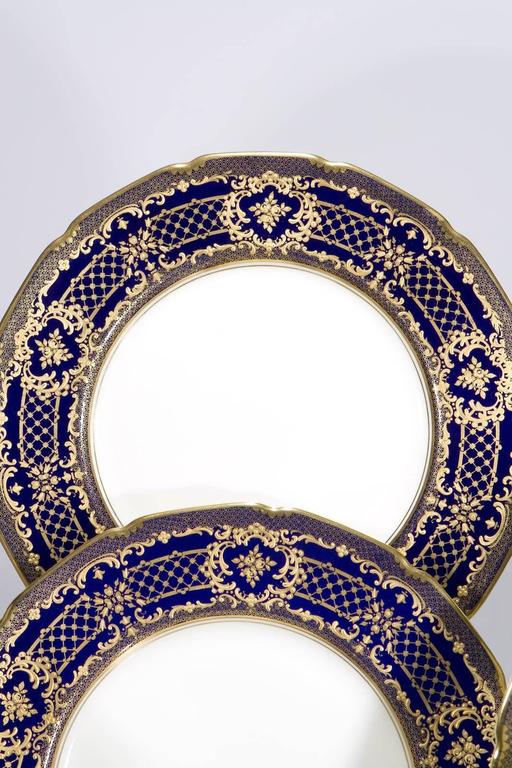 16 Royal Doulton Cobalt Blue Dinner Plates, Raised Paste Gold Rose