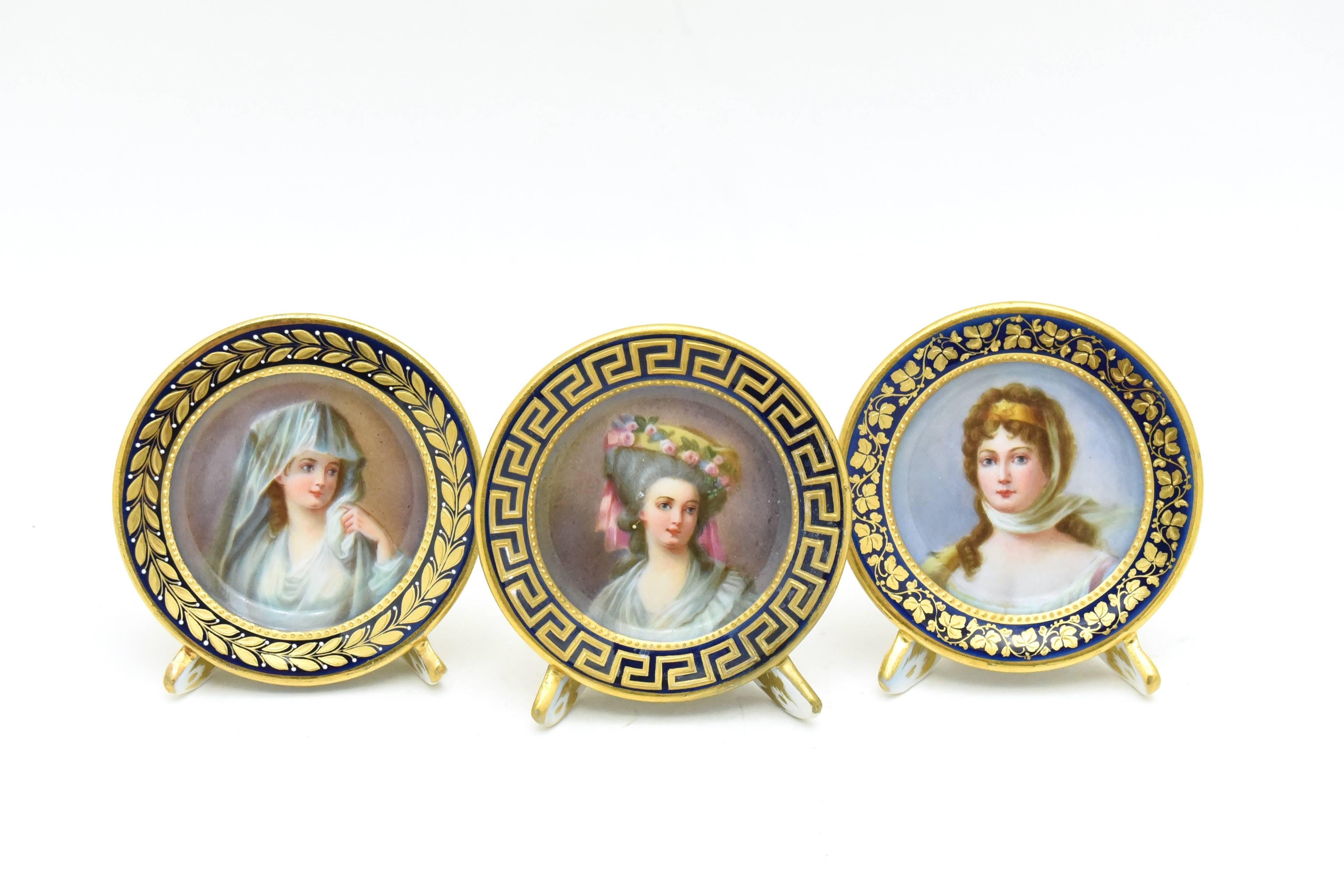 This is a rare set of 12 hand-painted placecard holders depicting portraits of French royalty. These portraits are named on the back along with the Dresden mark. Each one is framed in a deep cobalt blue border, highlighted with raised paste gold in