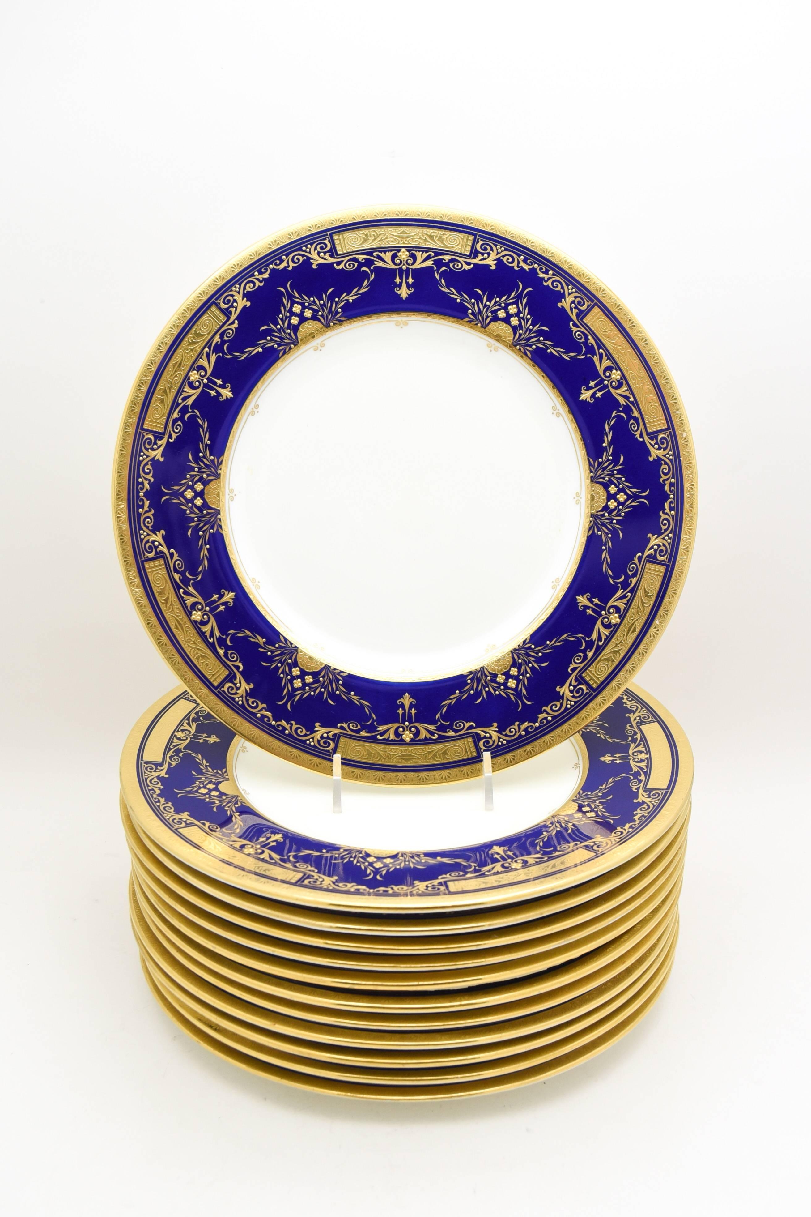 It is rare to find a true Arts and Crafts pattern on fine china of the period but this set of 12 Minton dinner plates accurately exemplify the style. Elegant but understated, the acid etched gold with applied 