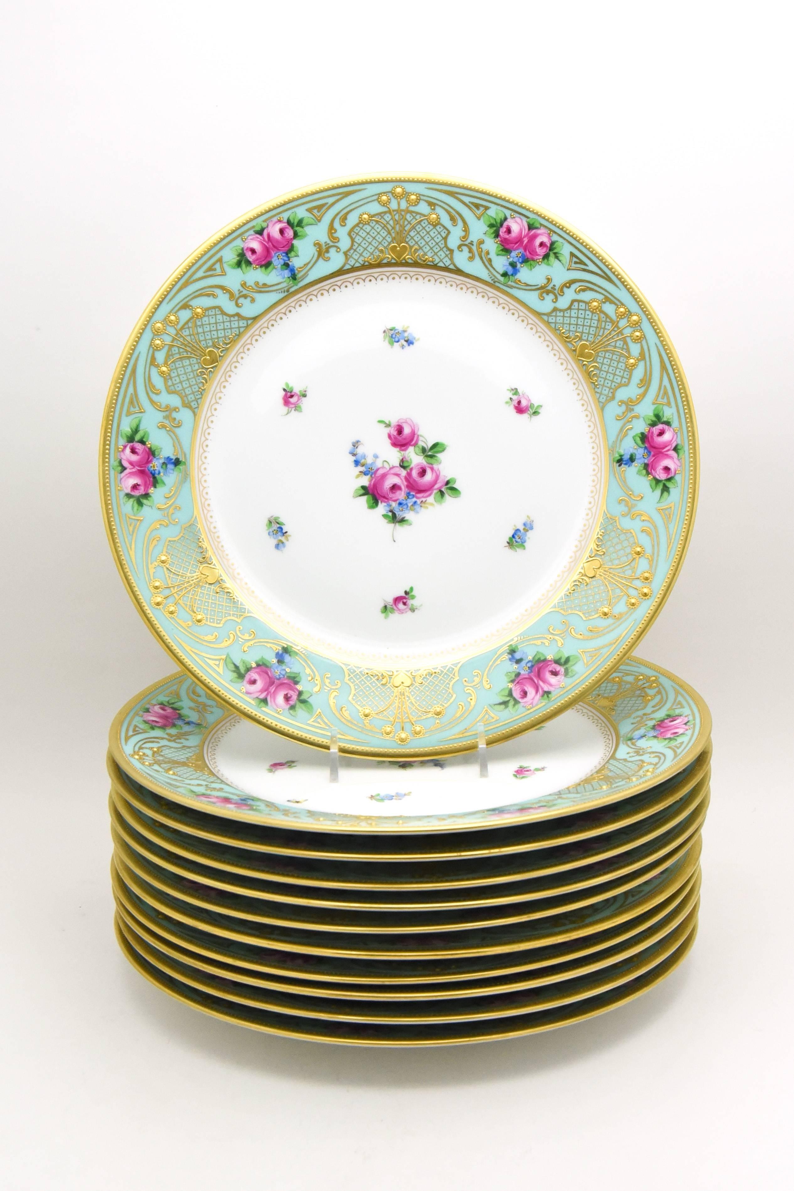 This set of 11 Art Nouveau dinner plates are in fabulous condition and exhibit the fine workmanship of Dresden porcelain. The wide robin's egg blue/soft turquoise border is decorated with hand painted roses and raised paste gold in a true Art