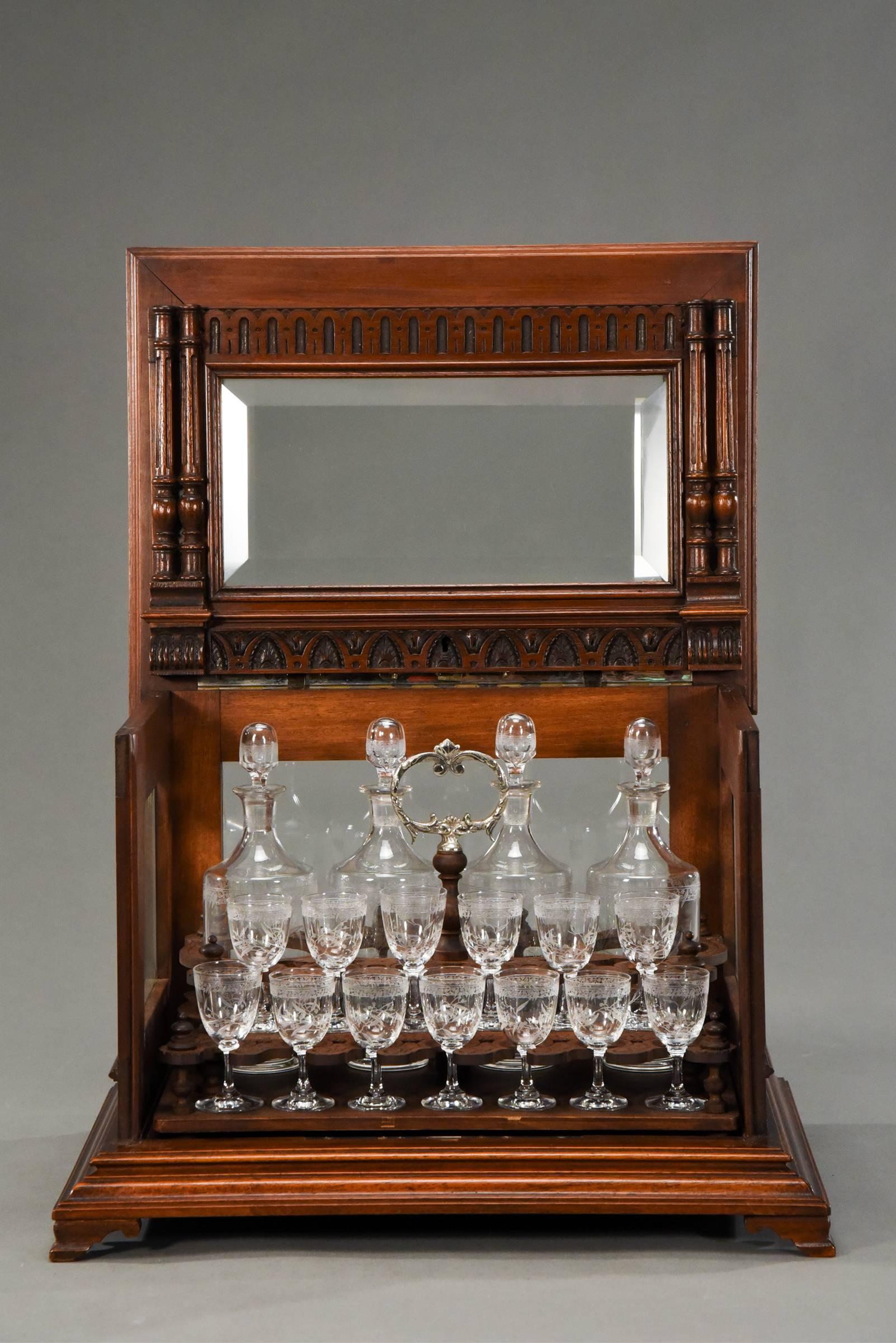This example of amazing workmanship coupled with a perfect set of hand blown crystal decanters and matching cordials made by Baccarat is hard to believe. Never used, it maintains the original paper labels that Baccarat used to sign their wares until