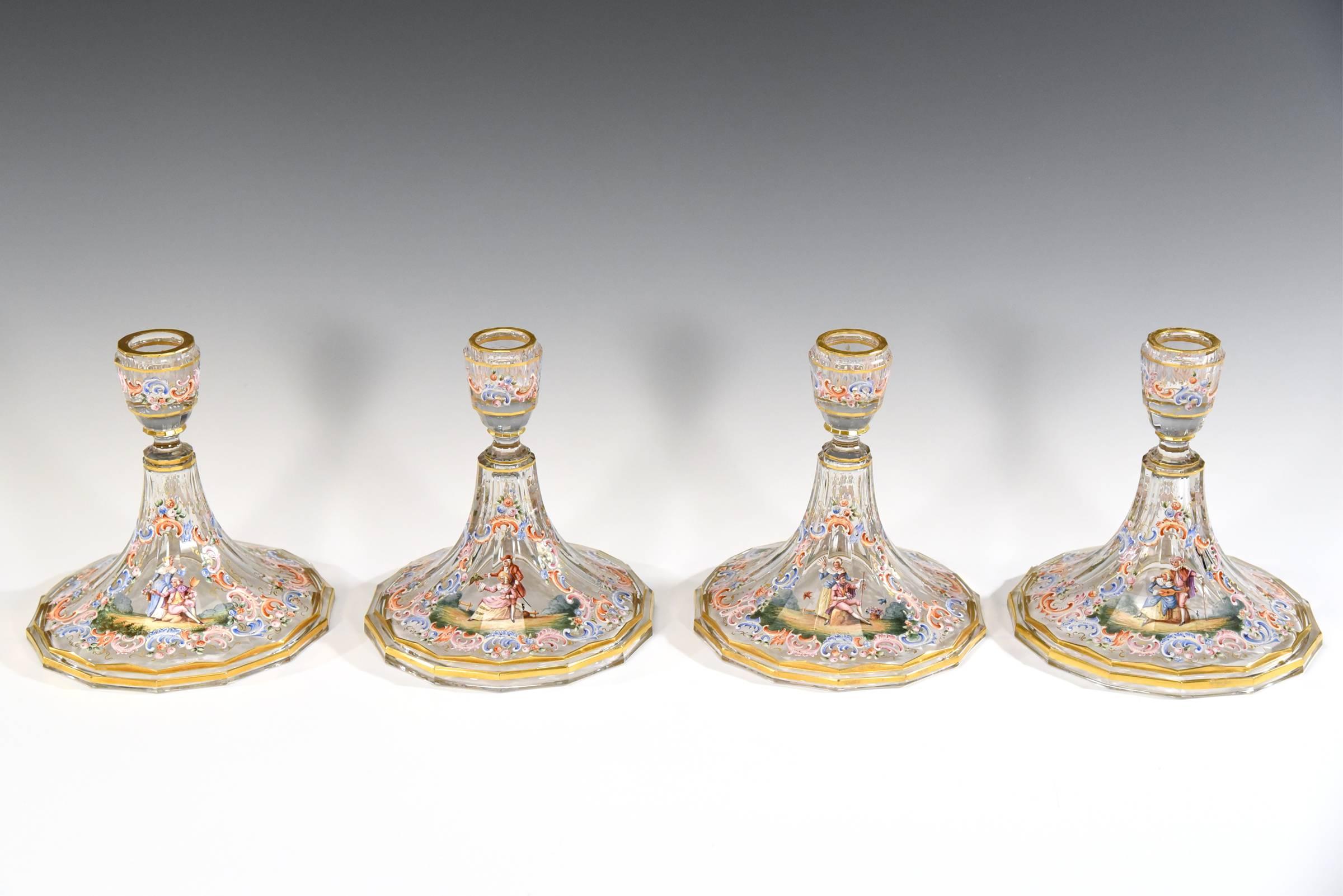 It is rare to find any candlesticks in this pattern, made by Lobmeyr but here is a set of four. Perfect for a large table, each one is hand blown crystal, panel cut and uniquely hand-painted in polychrome enamel with great detail of courting couples