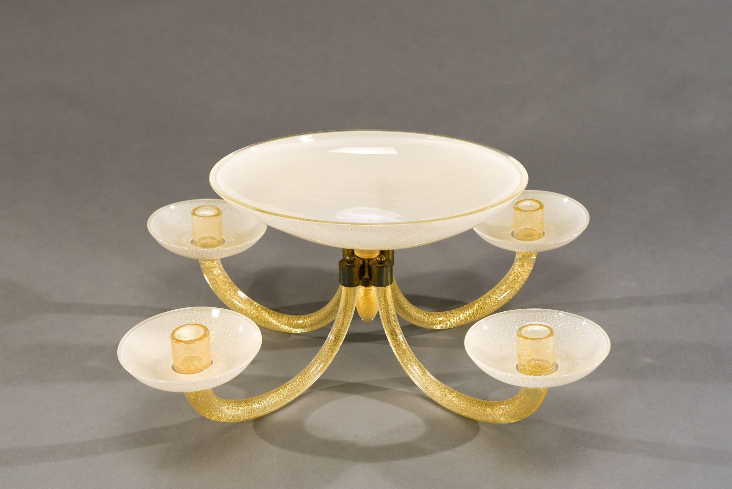 This is an exceptional and rare centerpiece made by Barovier and Toso,
circa 1930s-1940s. What sets this apart is the versatility and adjustability of the arrangement, allowing for many configurations and shapes. Starting with the hand blown oval