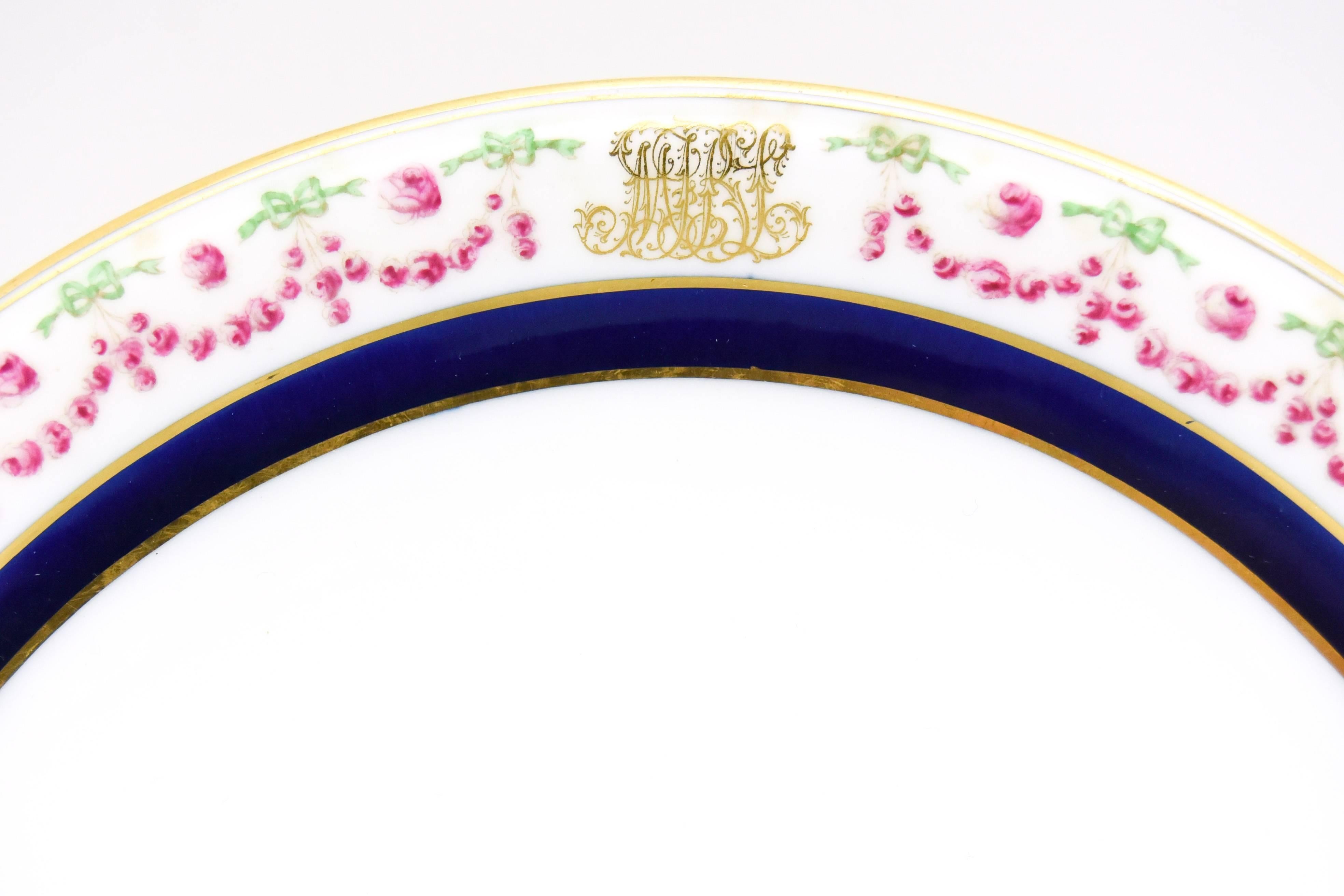 Early 20th Century Set of 12 Cauldon Porcelain Crescent Plates with Polychrome Enamel Decoration