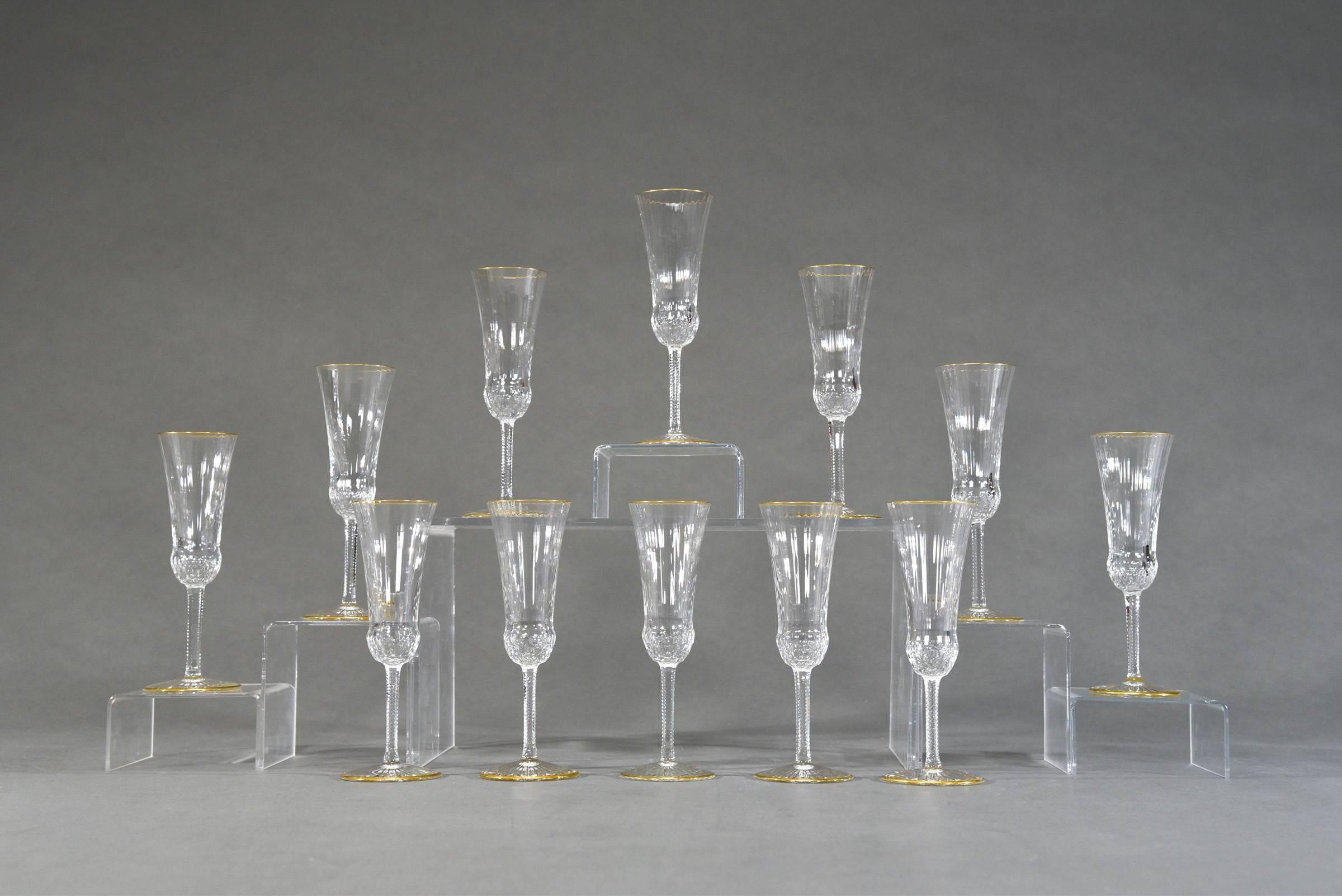 These are the classic, iconic champagne flutes made by St. Louis in a perfect set of 12. The subtle ribbed design is highlighted in gold and these are in excellent condition-ready for you next bottle of champagne!
   