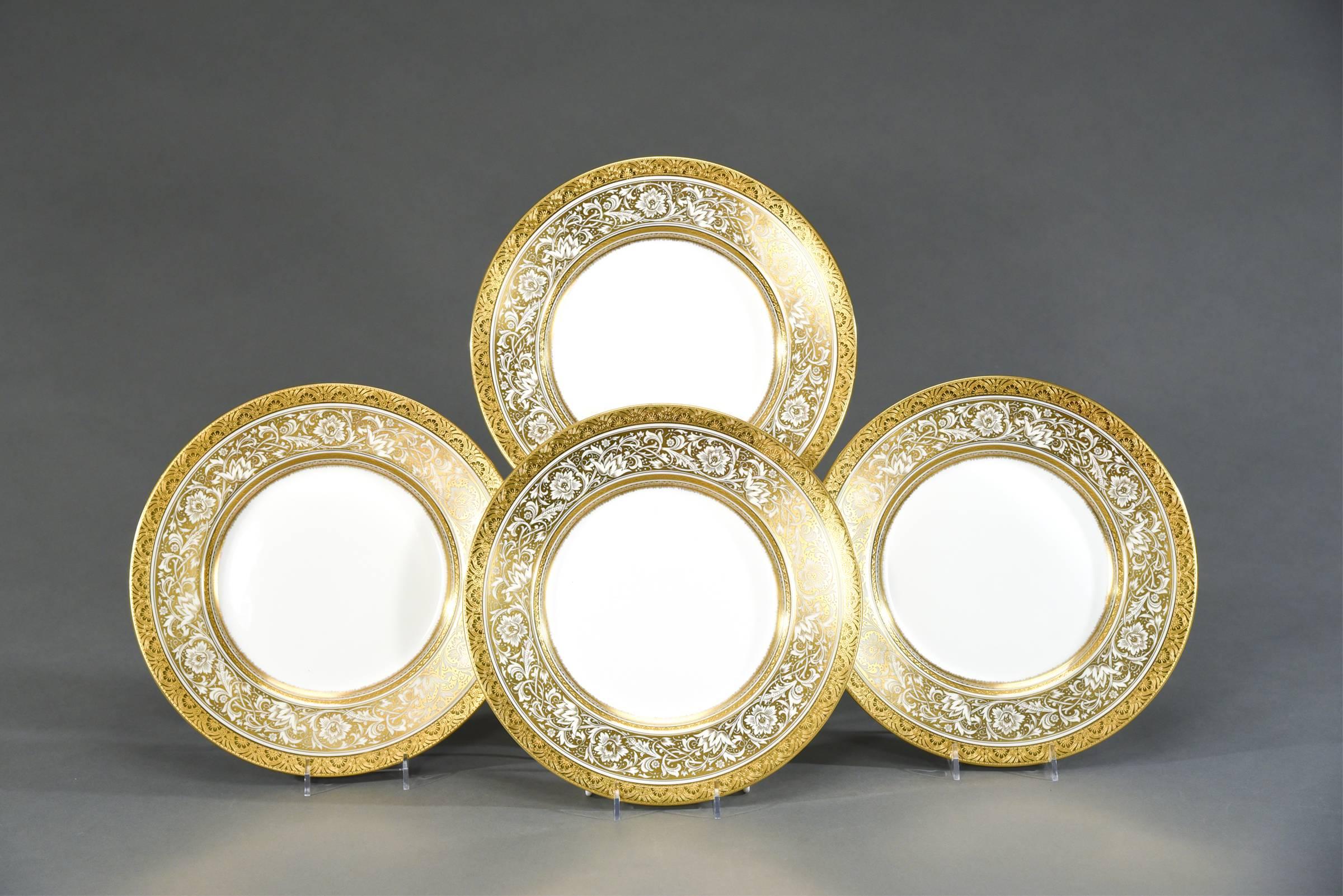 One of Minton's most popular patterns is named "Porcelain Ball” which features a large diameter plate bordered by a gold and white floral decoration and trimmed with an acid etched border. Made in the 1950s, these work well with many antique