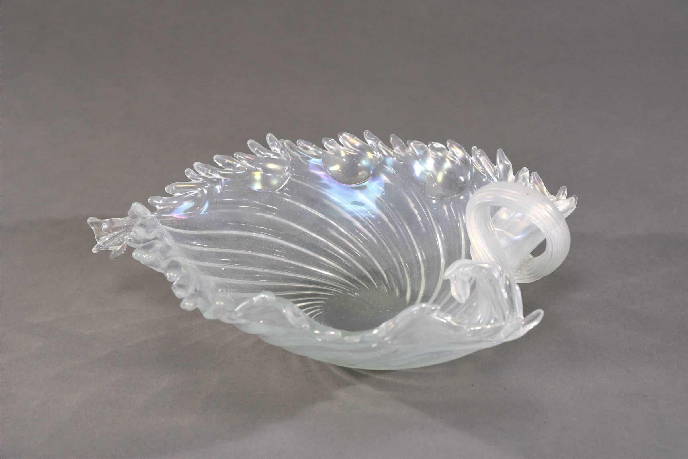 This large handblown Venetian centrepiece is large enough to be the focal point as a low centerpiece or used as a decorative piece on a sideboard or coffee table. The organic life-like shape, coupled with the rainbow iridescent ribbed glass is a