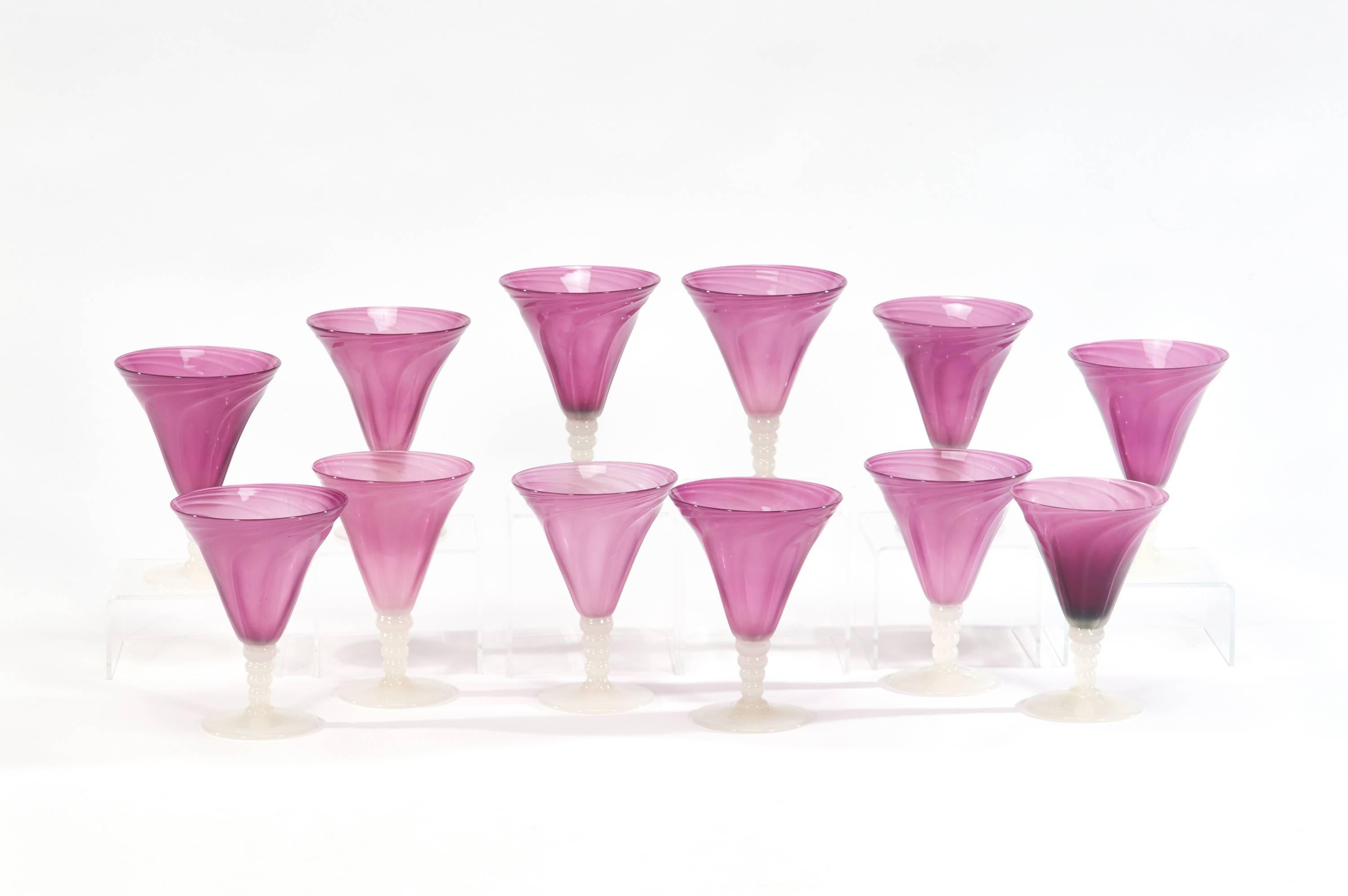 One is lucky to find a single example of this goblet but this is a set of 12 handblown lavender goblets made by Stevens and Williams. These predate the arrival of Frederick Carder at Steuben, when he was an artist and designer at Stevens & Williams