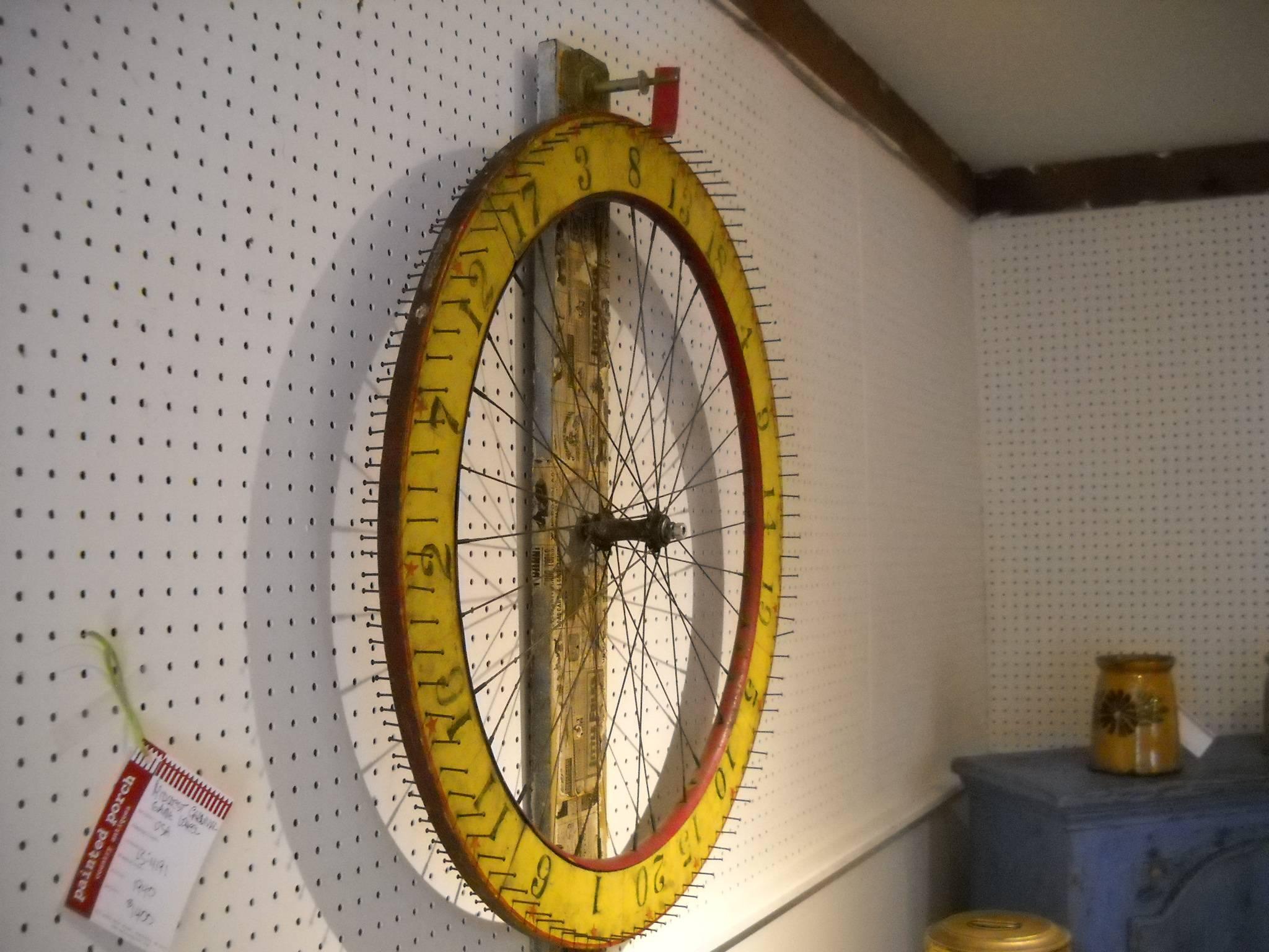 This is one of two Carnival game wheels we found. This one is from the Midwest and made out of a bicycle wheel, complete with a clicker that sounds when you turn the wheel. Wow, what a piece of folk art for your wall!