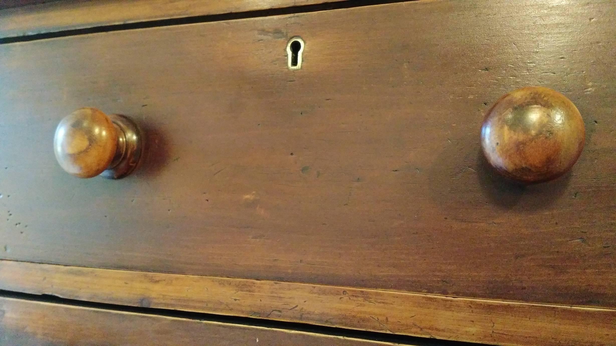 Rich chocolate brown wood and original knobs adorn this extremely nice sized chest of drawers. It's an eye catcher and extremely useful at the same time. Check the dimensions as they are quite pleasing. If you have the right small wall this piece