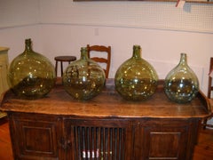A collection of 4 French wine jars
