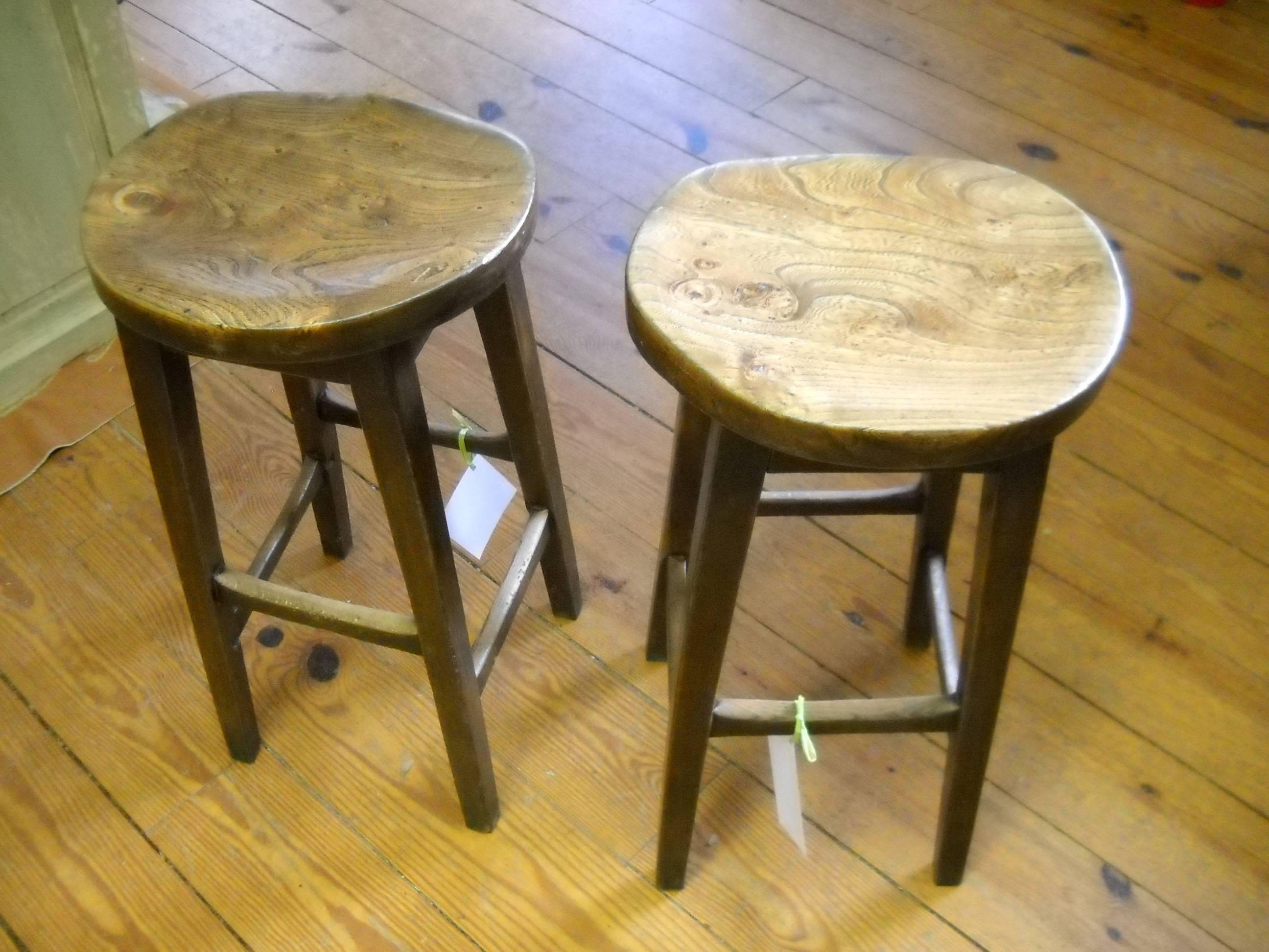 This pair of stools come from a pub in the UK. We have many stools in the store and all of them come from English pubs. However this pair are called saddle stools and are our most comfortable stools. The wood is elm and the grain is wonderful. There