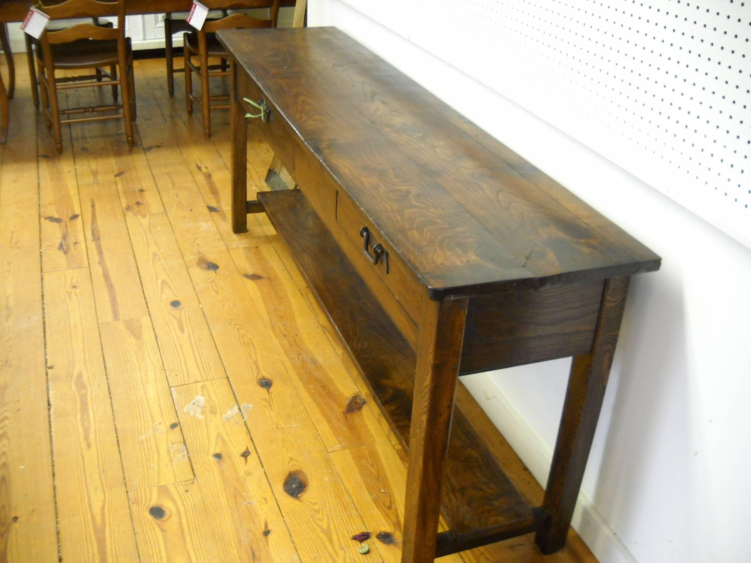 Chestnut is one of our favorite darker woods and combined with this 79 inch serving table with two uneven drawers and original hardware makes this a difficult piece to ignore. The French loves drawers of different sizes and everything about this