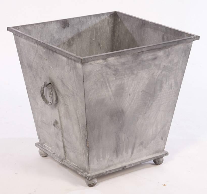 Two pairs of Classic Regency style cast iron garden zinc colored planters available with rings in wonderful weather resistant lead grey color. Priced per pair.

Search terms: zinc planters, lead planters, neoclassical style planters, Versailles