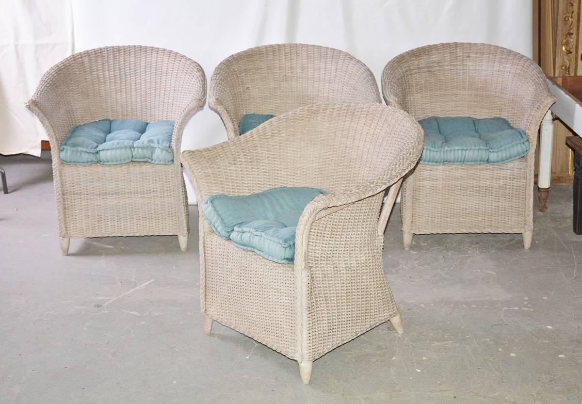 Set of four very comfortable rattan dining chairs in a rustic grey color. Great for a patio or kitchen chair. Cushions shown are for photography purposes only. New cushions will be needed. One of the chairs has a small hole on the seat.

Measures: