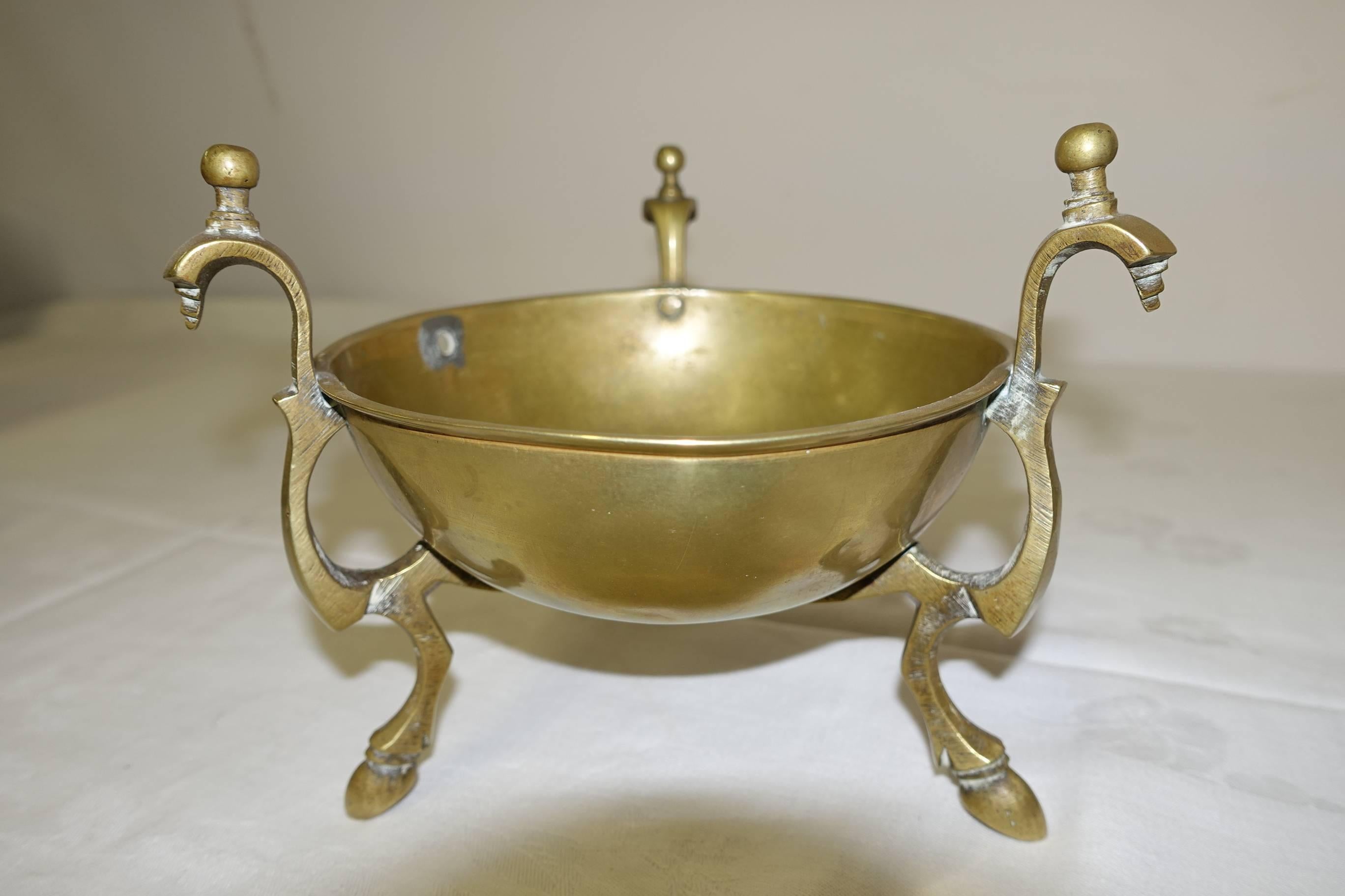 Charmingly elegant antique Empire style brass bowl centerpiece on tripod hoofed feet and decorative handles in an 'abstract' animal form. Lovely aged brass patina all-over, can easily be polished.
  