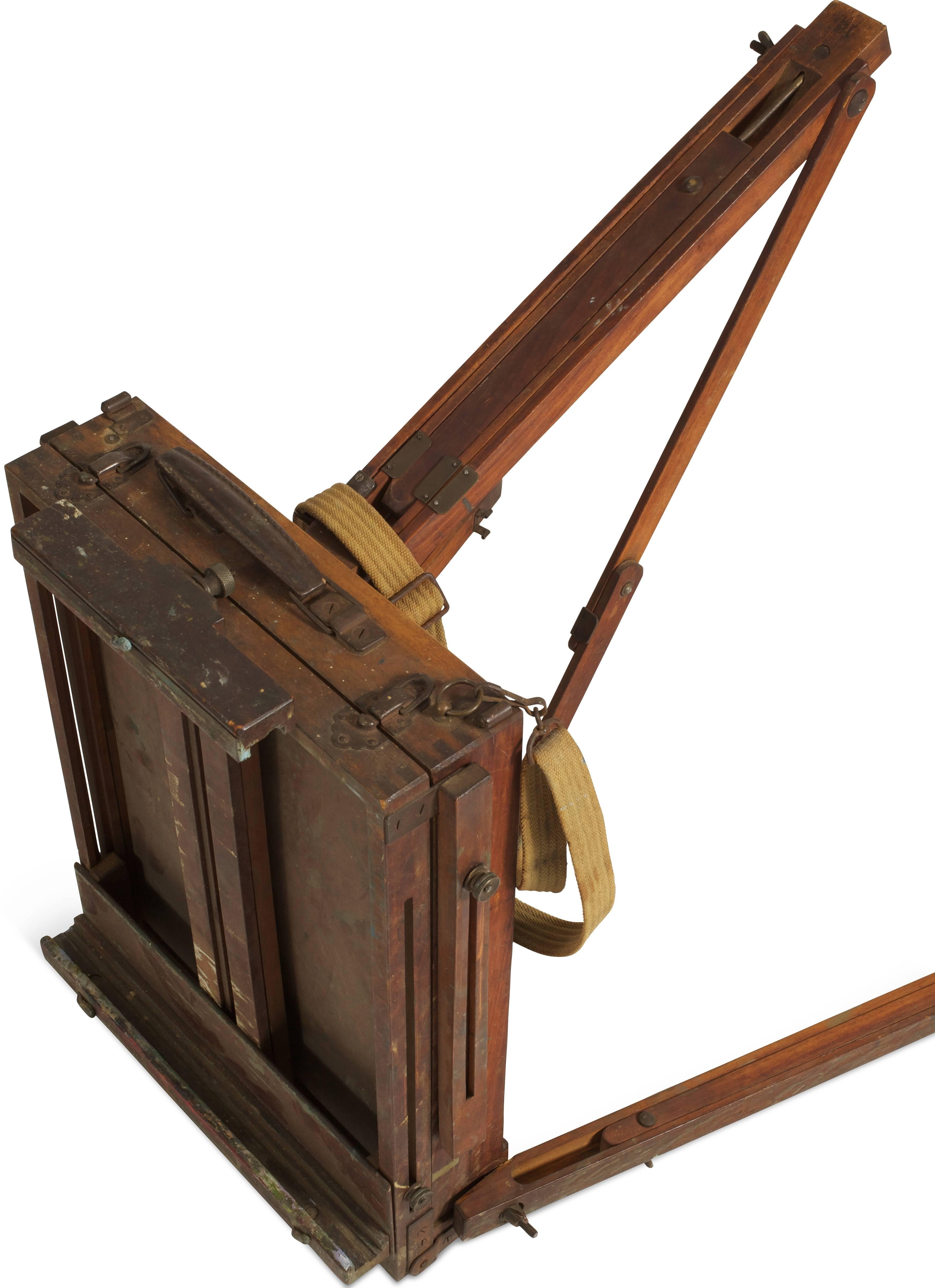 Ingenious construction gives this portable painter's easel and carrying case three folding and adjustable legs to stand on for either standing or sitting heights, a drawer for supplies (presently filled with used paint tubes, brushes, charcoal,