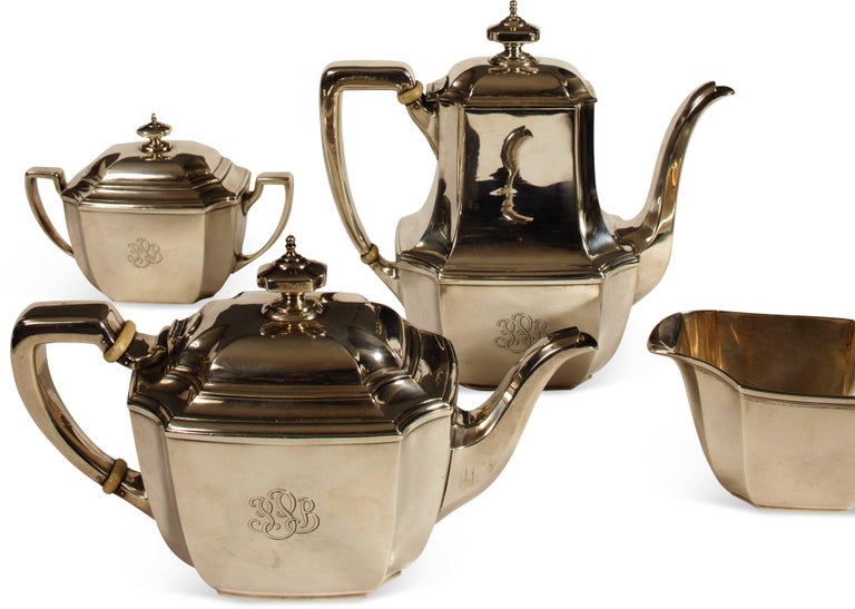 Tiffany & company four-piece sterling silver coffee and tea set, circa 1940. Comprised of coffee pot, tea pot, sugar and creamer, all with faceted corners and monogrammed 'PPB', all marked '18389' below. 66.6 T.O.
Price quoted is for the entire set