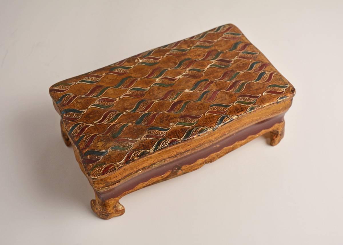 The vintage Florentine giltwood box with feet also has a green and red painted and hinged top. Stamped 