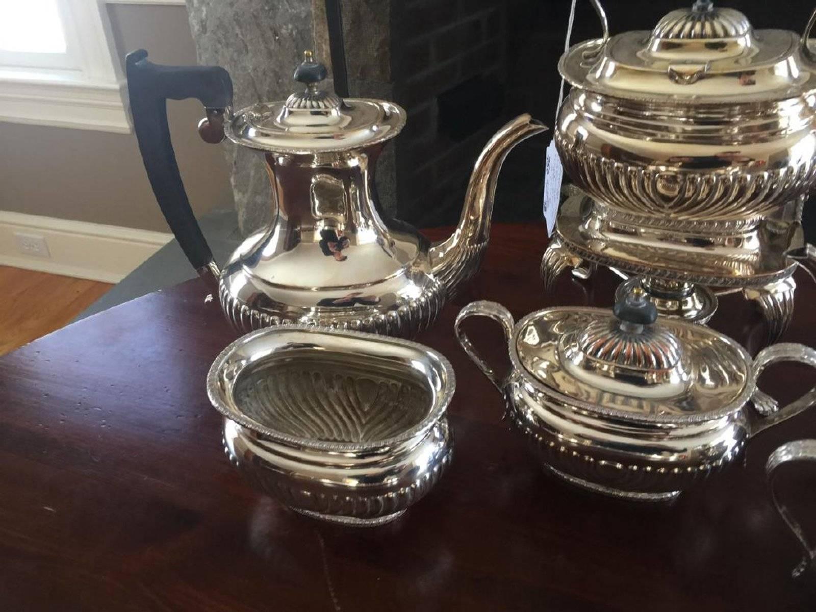 Sheffield silver plate coffee and tea service. Six-piece set including coffee pot, tea pot, sugar, creamer, etc. Marked SHEFFIELD on bottoms. Tallest measures 13 inches in height. Hallmarked for Israel Freeman & Son Ltd.

Measures: Tall teapot - D