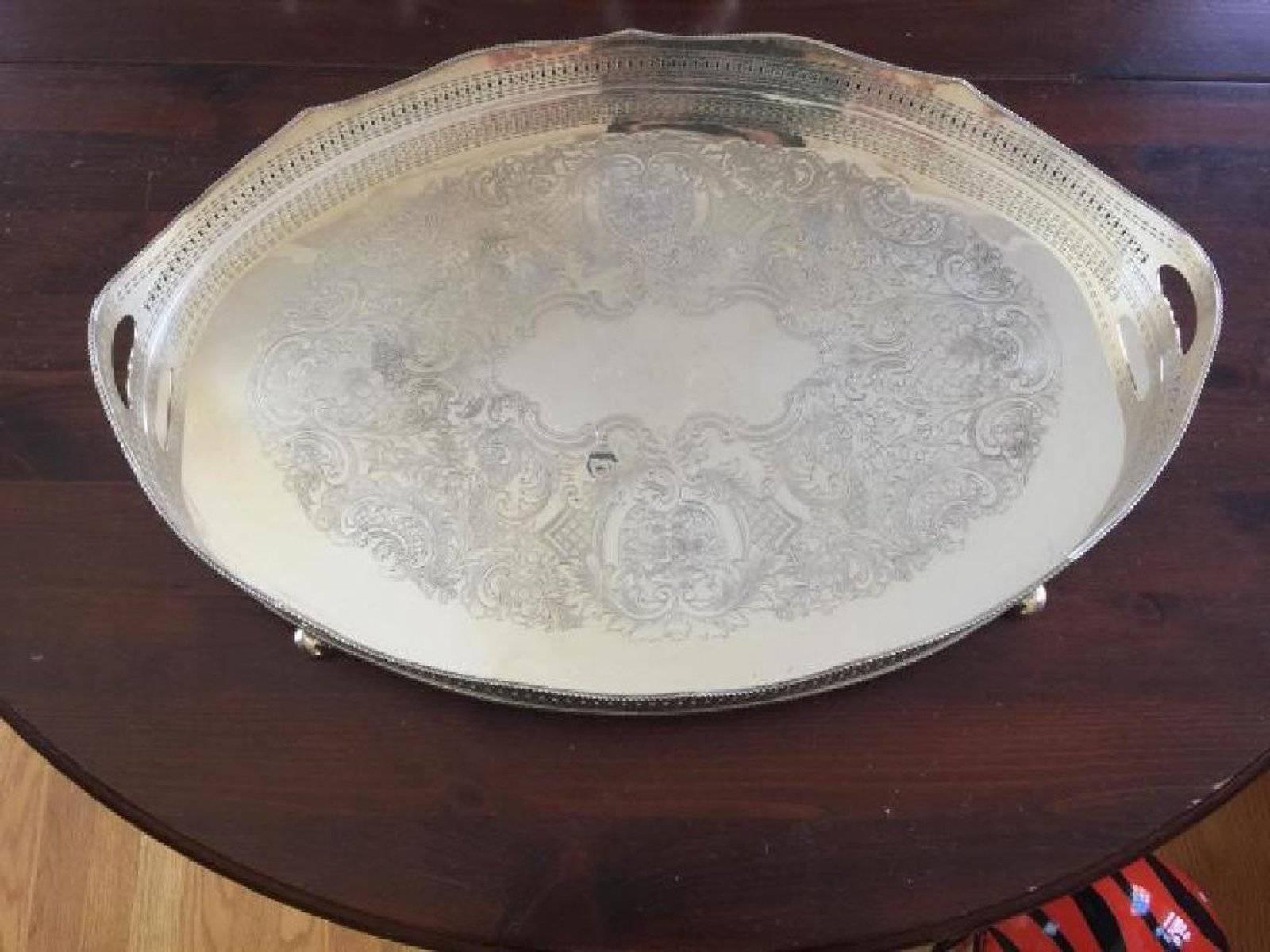 Large silver over copper oval gallery serving tray. Tooled with ornate intricate reticulated fret work.
Search terms: Regency style, Edwardian style.