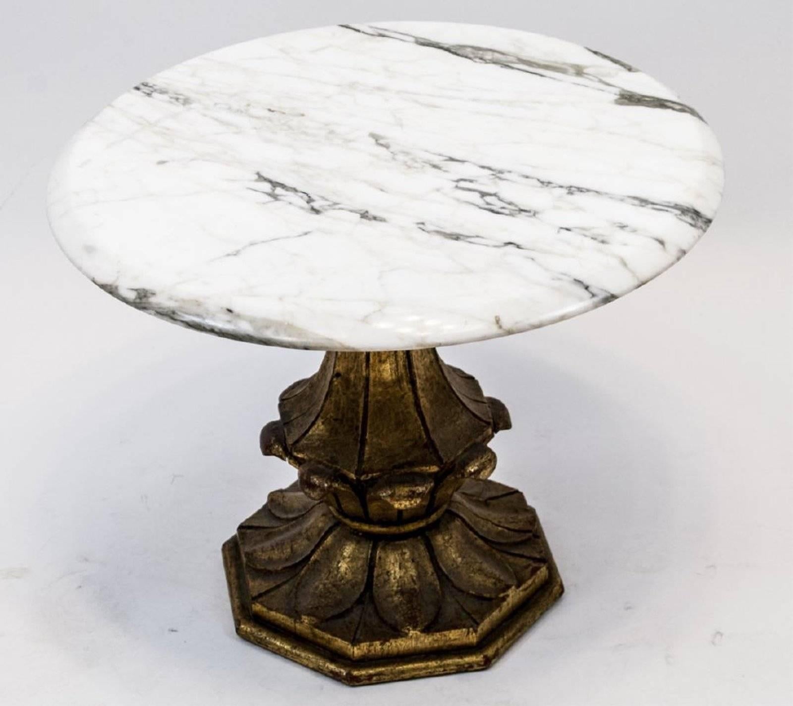 Marble side or occasional table features a round marble top and a hand-carved wooden base painted gold.
 