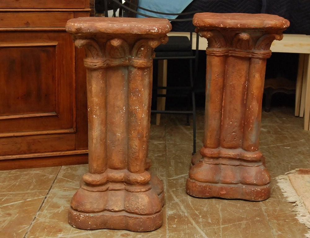 Pair of Italian Renaissance style terracotta pedestals.  Add a top of your choice for a console, sofa table, a buffet sideboard, entry hallway table or dining table.  Wonderful aged patina.

Keywords: console table, neoclassical.