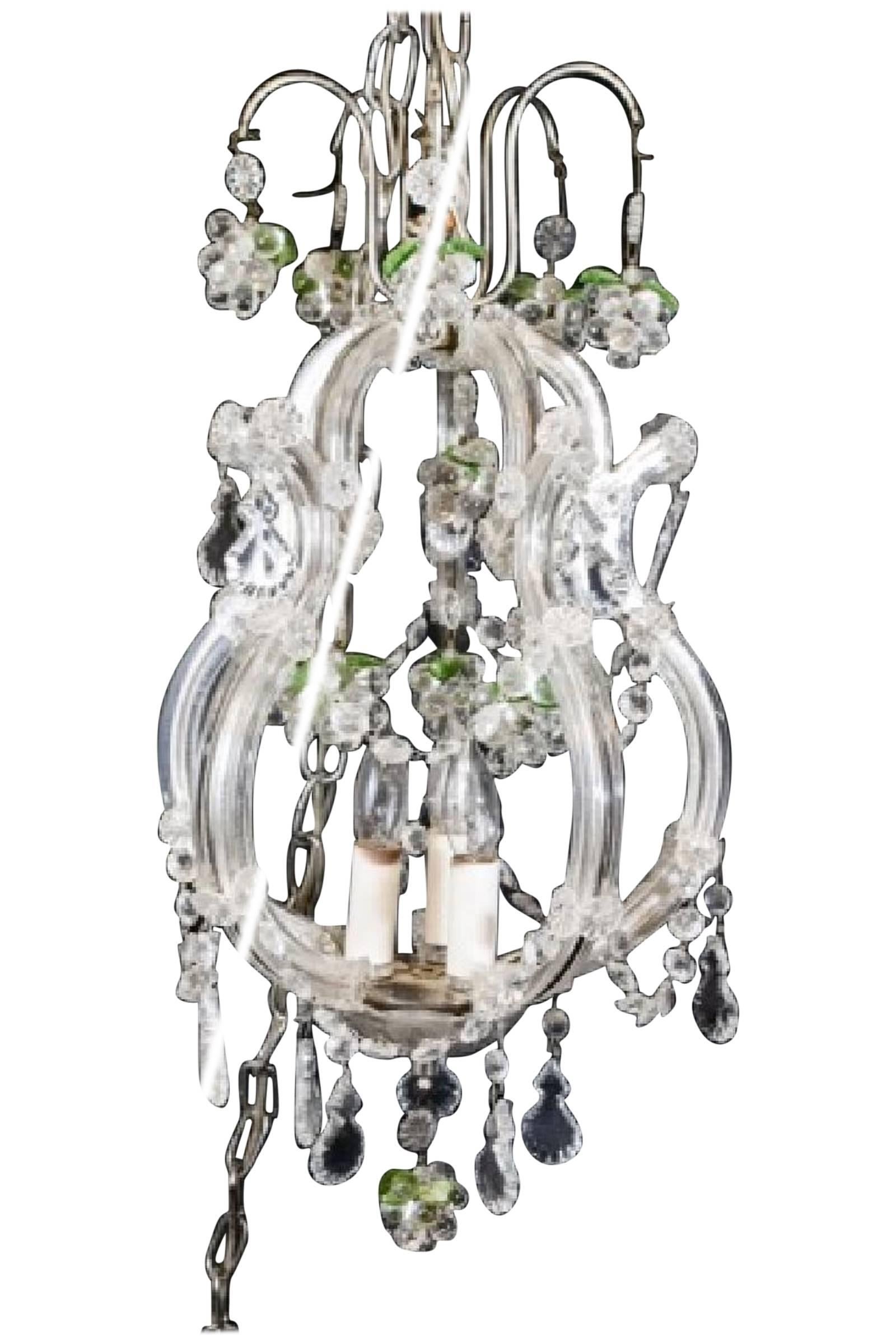 Elegant petite art glass and crystal chandelier with grape motif clusters and green crystal leaves. Three interior lights. Perfect for the powder room or any room that needs a small light.
OFFERING FREE SHIPPING WITHIN US CONTINENT.  PLEASE JUST ASK