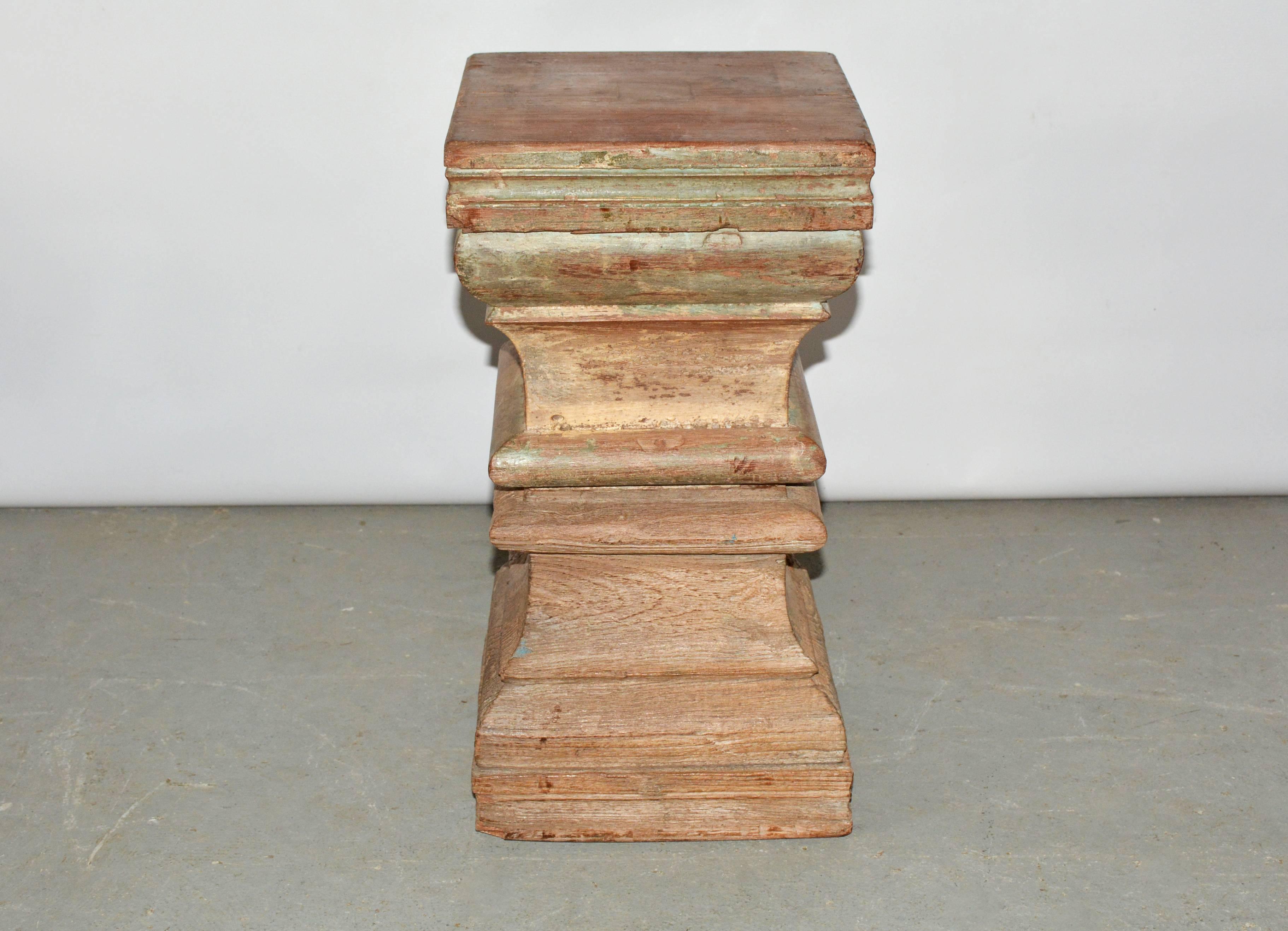 Unique Indian carved wood plinth table base or stool. Beautifully hand-carved with wonderful wood patina showing remnant of green paint. Once part of a column. Reduced to a size usable as end table, occasional table or stool for extra seating.