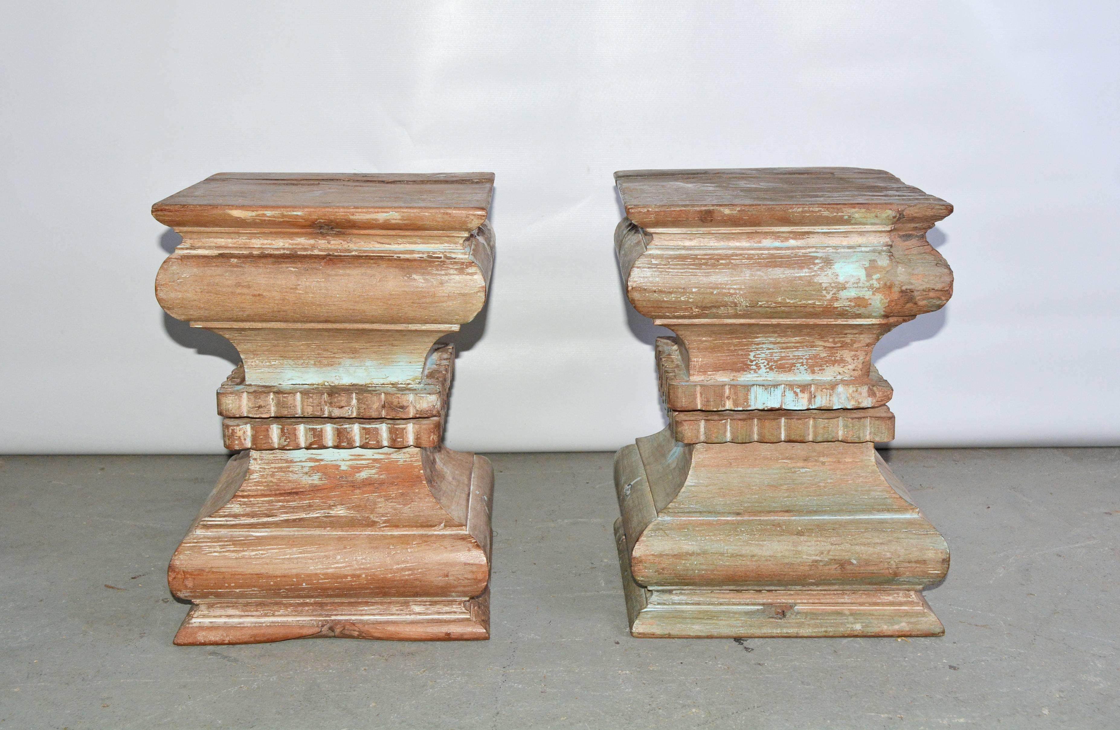 Two very special and very similar Indian carved wood pedestal, plinth, table bases or stools.  Beautifully hand-carved with wonderful wood patina showing remnant of turquoise color paint. Once part of a column, reduced to a size usable as end